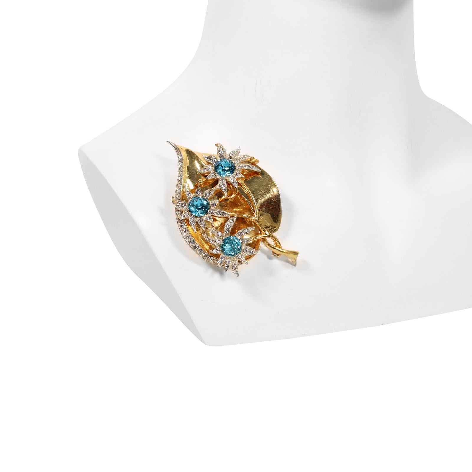 Vintage Coro Craft Sterling  Gold Leaf Brooch with Flowers Circa 1940s. Leaf with Elevated Branches of flowers in Aquamarine Colors and Clear Crystals. This brooch is truly spectacular and though it is from the 1940s it has a very modern look at the
