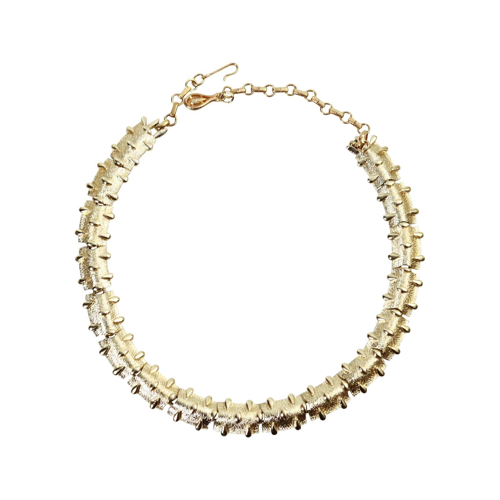 Vintage Coro Gold Tone Nubby Choker Circa 1970s. This is a great choker. Just a quick throw on hat will look great with a white t-shirt or white shirt and jeans and elevate your look.  It also has enough chain that you could wear it lower should you