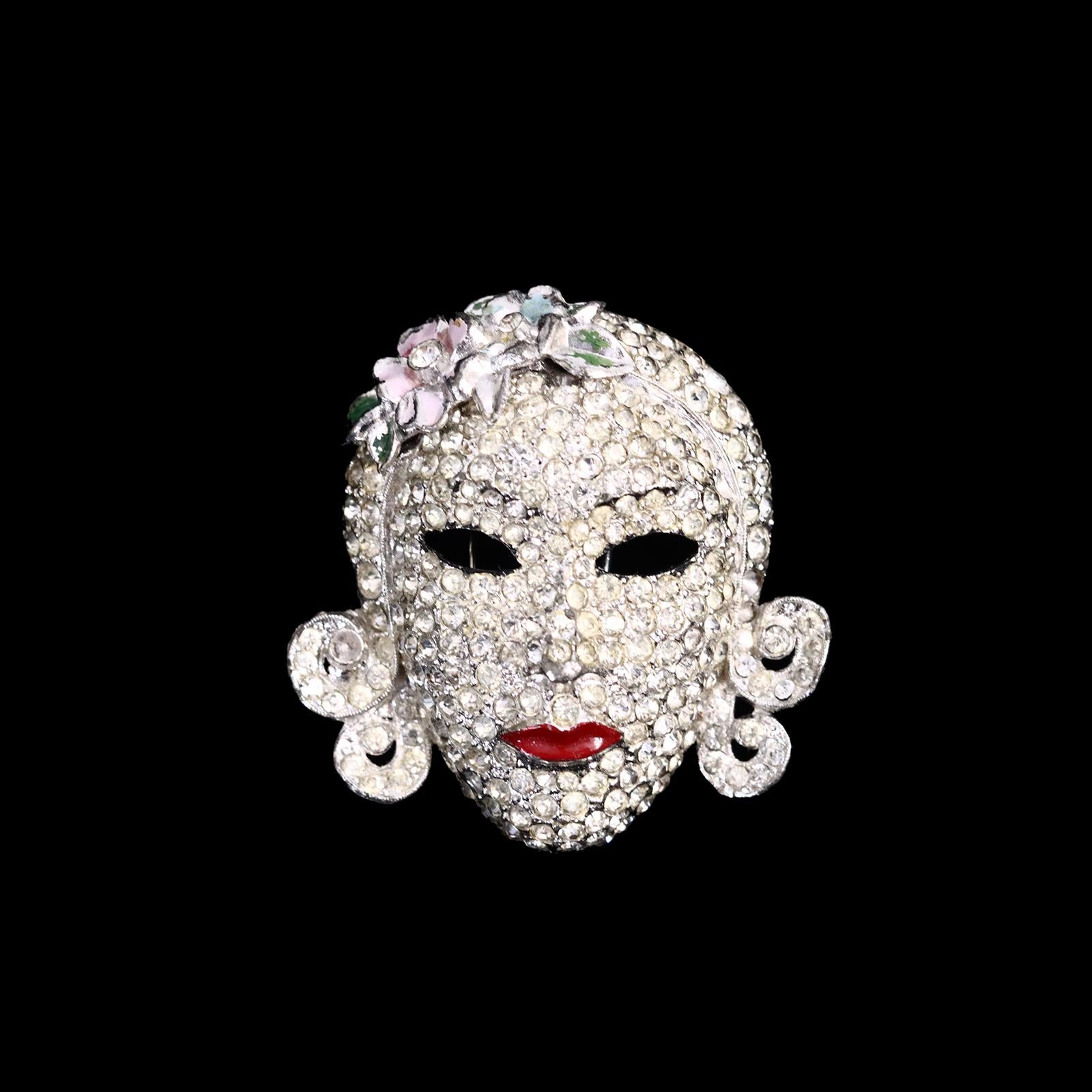 Vintage Coro Lady Face Fur Clip. Iconic brooch from the 1940s. She is wearing a beautiful headband of flowers and red lips. Stunning and so special. A very classic clip. Because this is a fur clip it would also look very good on a black silk cord