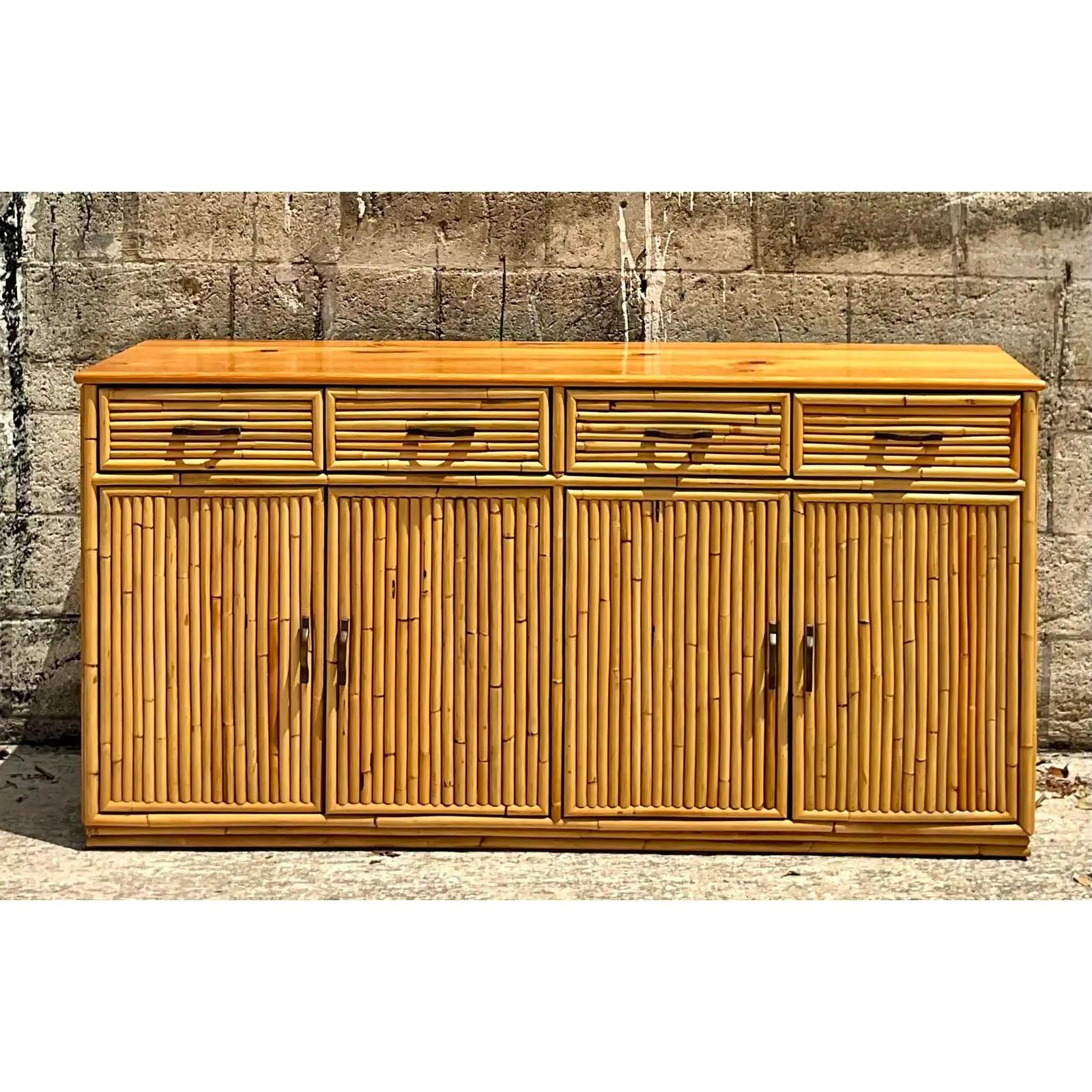 Fantastic vintage Coastal credenza. Fab bamboo frame in a chic and simple design. Lots of great storage below. Acquired from a Palm Beach estate.