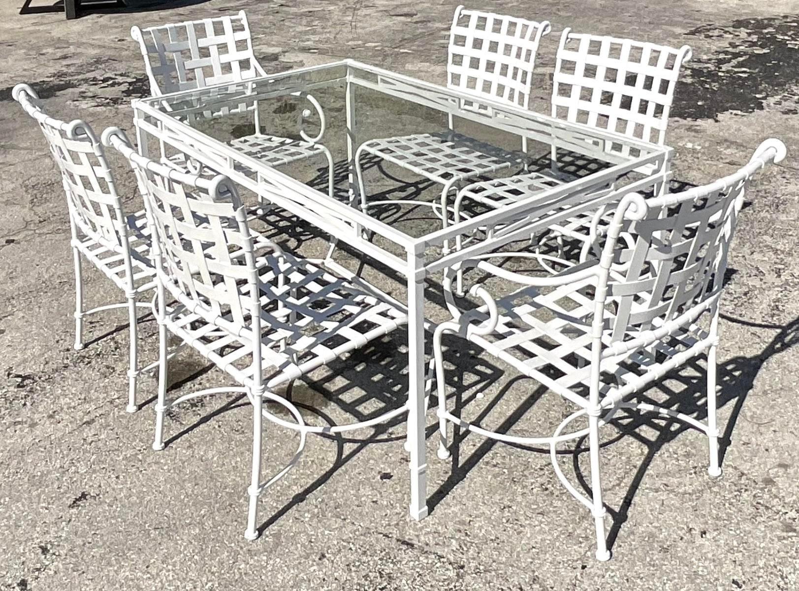 A fabulous vintage Coastal outdoor dining set. Made by the iconic Brown Jordan. The chairs are part of their Florentine collection and the table is from the Venetian collection. Fully restored with full sandblasting and powder coating in a high