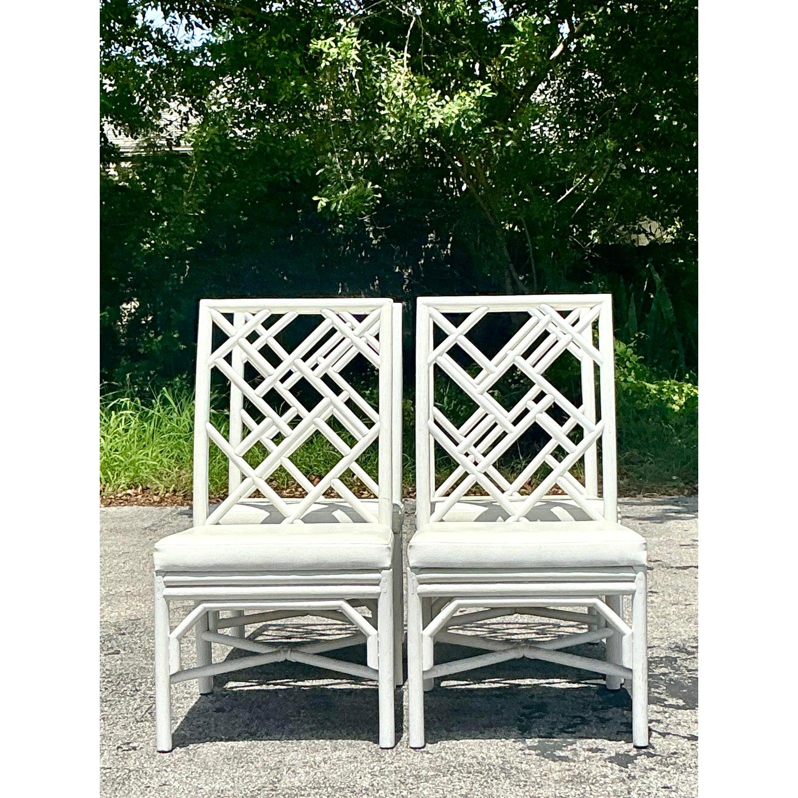 Transform your dining space with this exquisite set of four Vintage Chinese Chippendale Lacquered Dining Chairs, a harmonious blend of classic design and enduring coastal elegance. Each chair features the iconic lattice back motif, meticulously