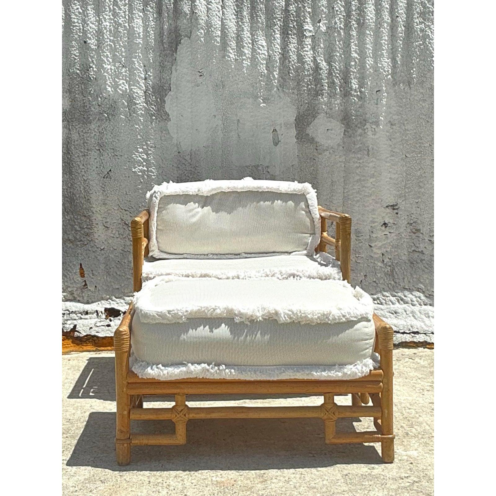 Unwind in style with this vintage coastal Ficks Reed lounge chair and ottoman set, a beautiful example of tropical modern design from a celebrated American maker. The intricately crafted rattan frame showcases classic island-inspired lines, while