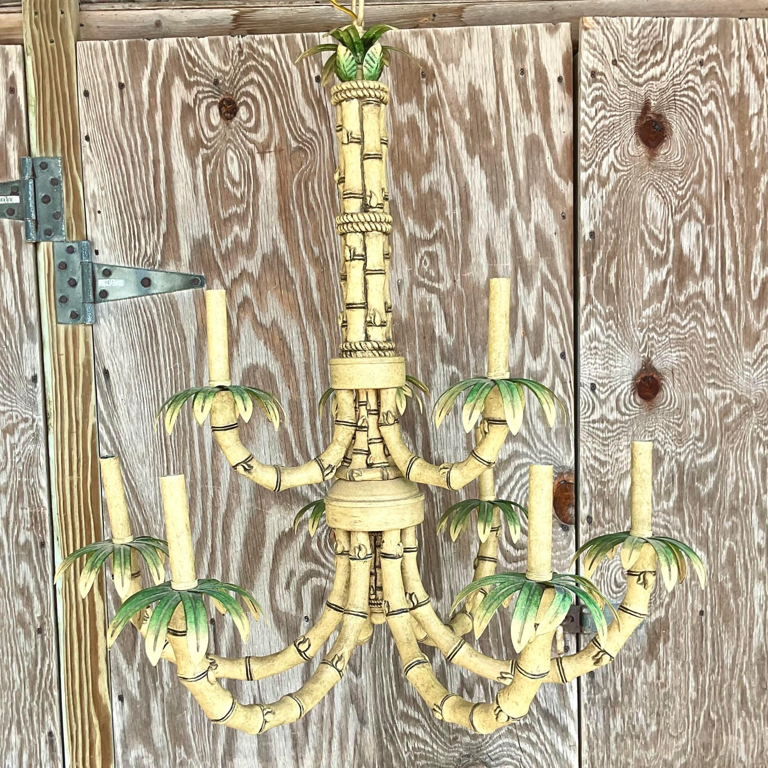 A fantastic vintage coastal chandelier. A chic bamboo design in a painted metal construction. Acquired from a Palm Beach estate.