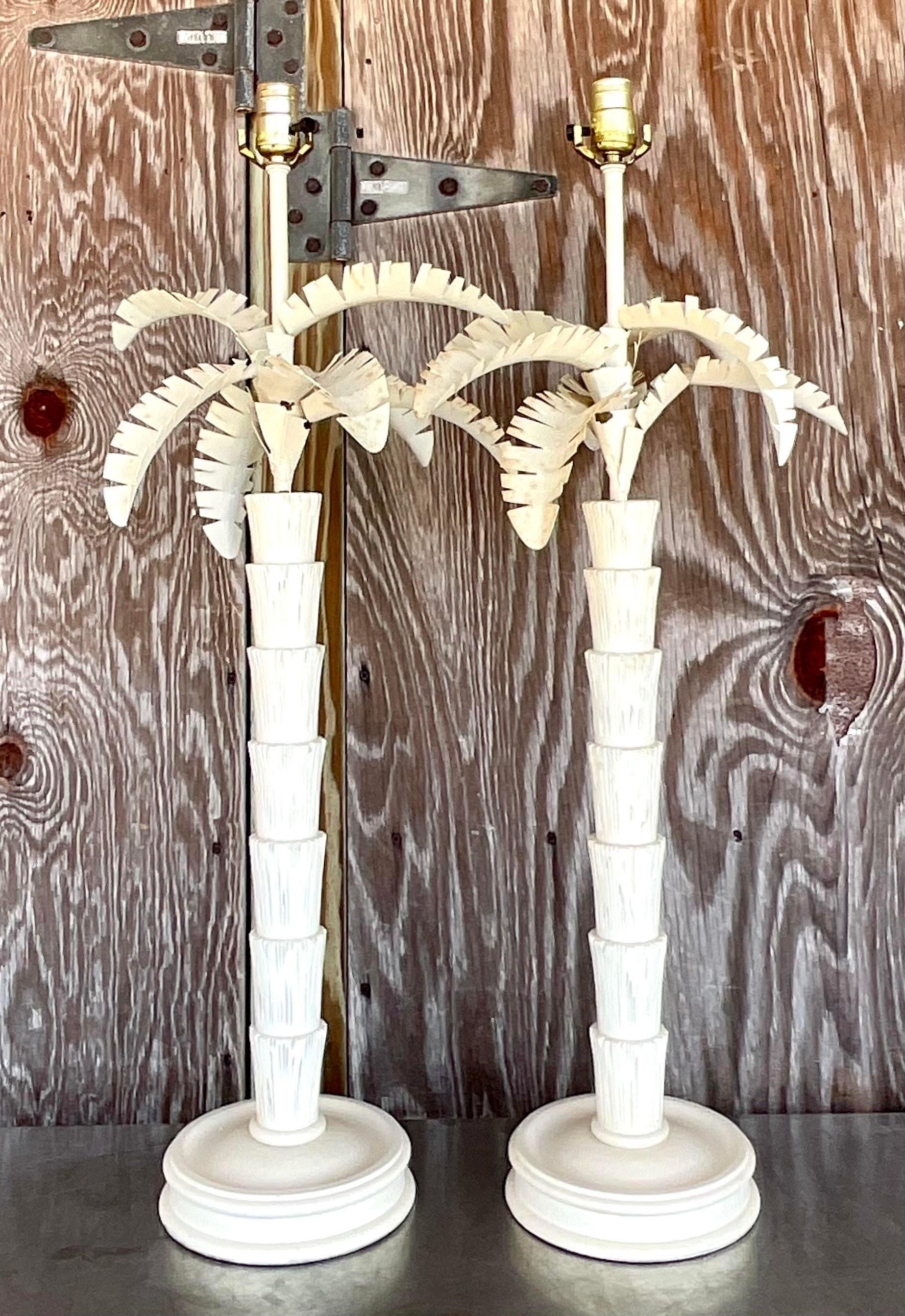 Illuminate your coastal retreat with this captivating pair of Vintage Coastal Punch Cut Metal Palm Tree Lamps. Evoking the relaxed elegance of American coastal living, these lamps blend intricate punch cut metalwork with the iconic silhouette of