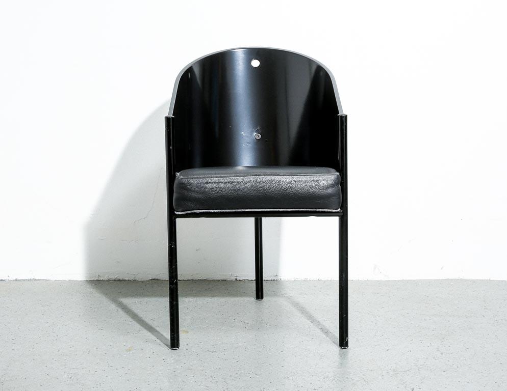 'Costes' side or dining chair designed by Philippe Starck for Driade. Originally conceived as the seating for the Café Costes in Paris, also designed by Starck. Black painted tubular frame, black shell upholstered in black leather. 19