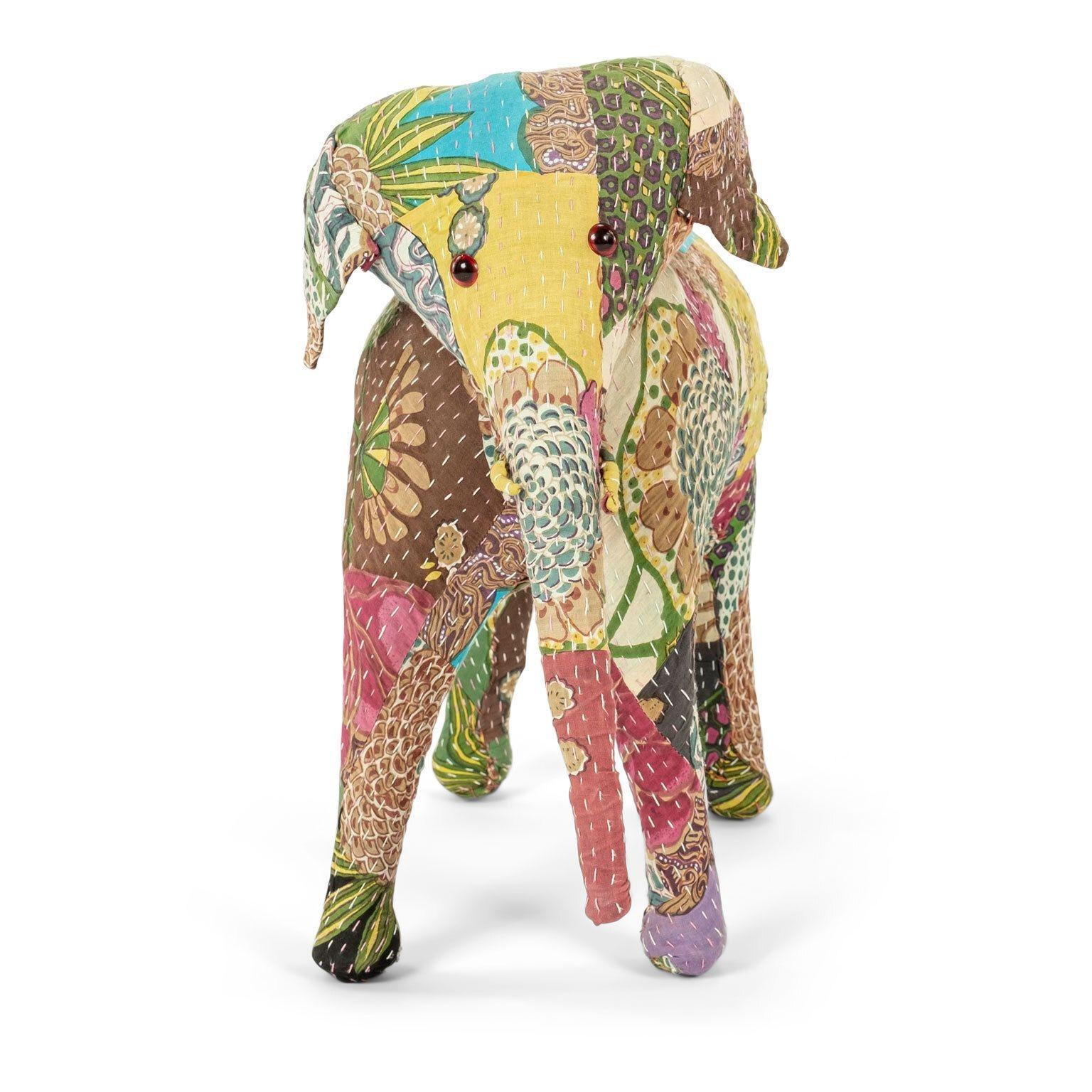 Vintage cotton elephant, covered in Indian textiles, retailed in the 1950s by Harrods. Interior frame composed of wire and straw. Textiles originally sourced through Liberty's of London.