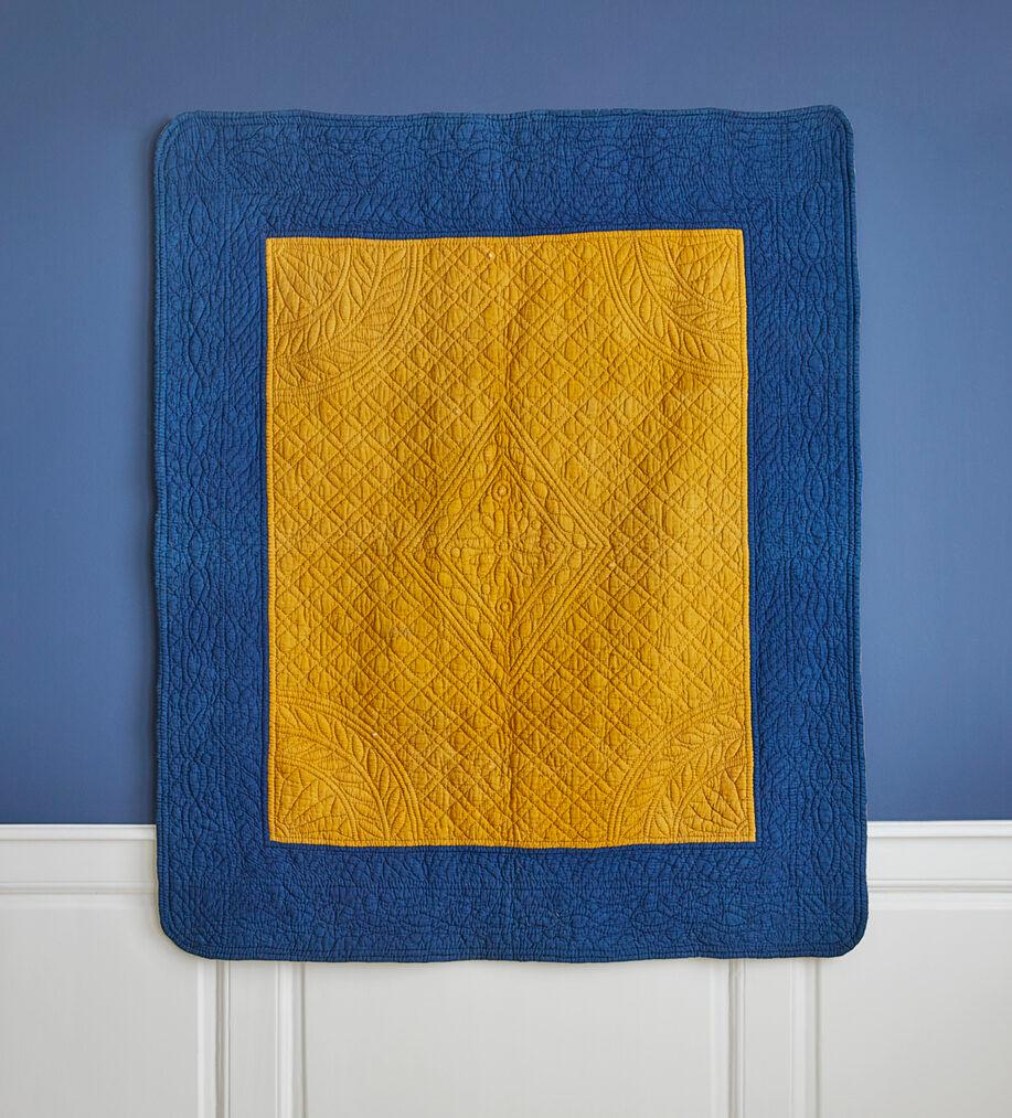 France, Early 19th-century

Antique cotton quilt with a border of a beautiful shade of indigo and a gorgeous saffron yellow center. Simple stitched patterns of diamond shapes with a flower motif at the center.

H 158 x W 132 cm
