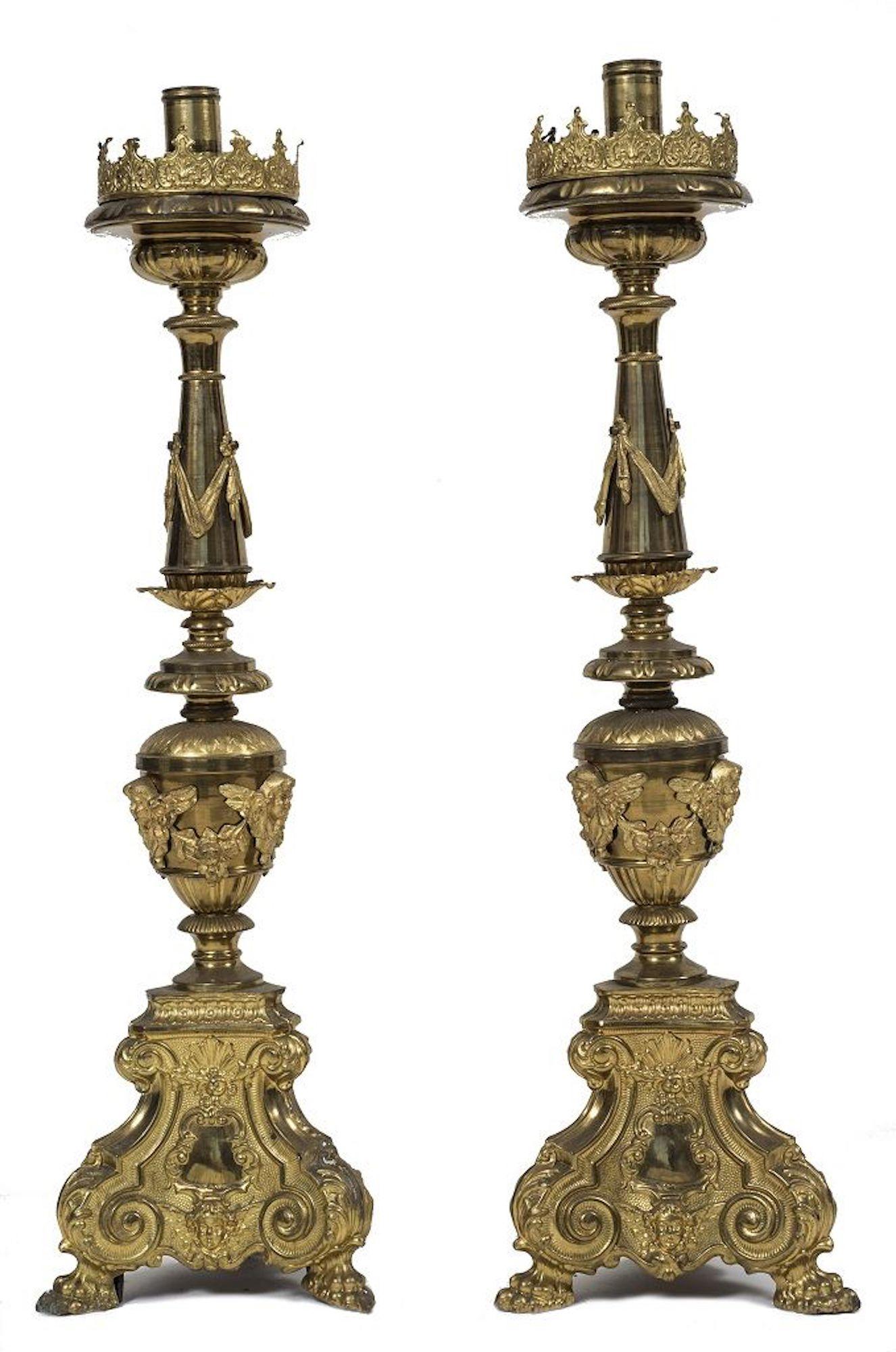 Couple of big candlesticks is a very refined decorative object in brass and gilded metal.
In Baroque style.
Realized at the end of the 18th century.
Very good conditions.

This object is shipped from Italy. Under existing legislation, any