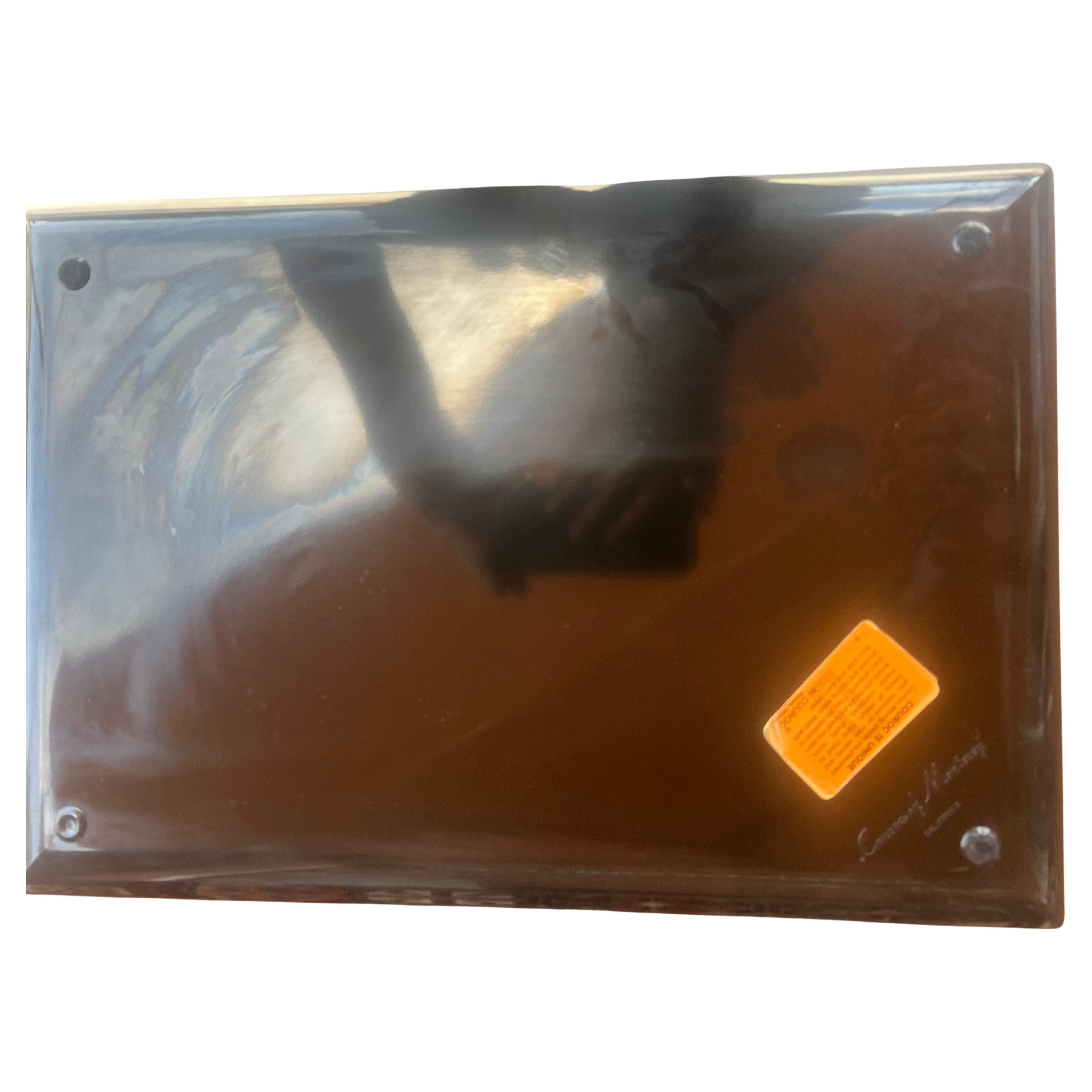 Whimsical mid century serving tray by Couroc of Monterey, made from phenolic resin and inlaid with wood and brass depicting seals with a bird perched on its head and the sun . Phenolic resin is resistant to damage from alcohol and water.  This