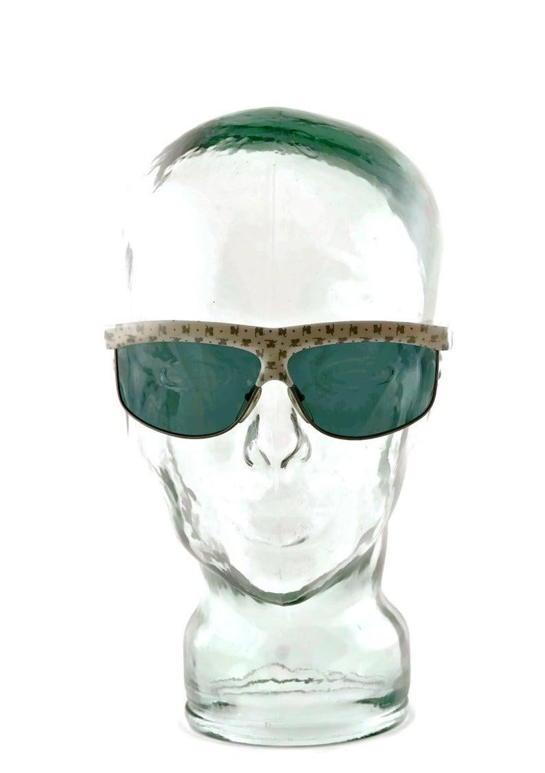 Vintage COURREGES Multiple Logo Monogram Sunglasses

Measurements:
Frame Height: 2 1/8 inches (5.39 cm)
Hinge to hinge Width: 6 1/8 inches (15.55 cm)
Temples: 5 4/8 inches (13.97 cm)

Features:
- 100% Authentic ANDRE COURREGES.
- White sunglass