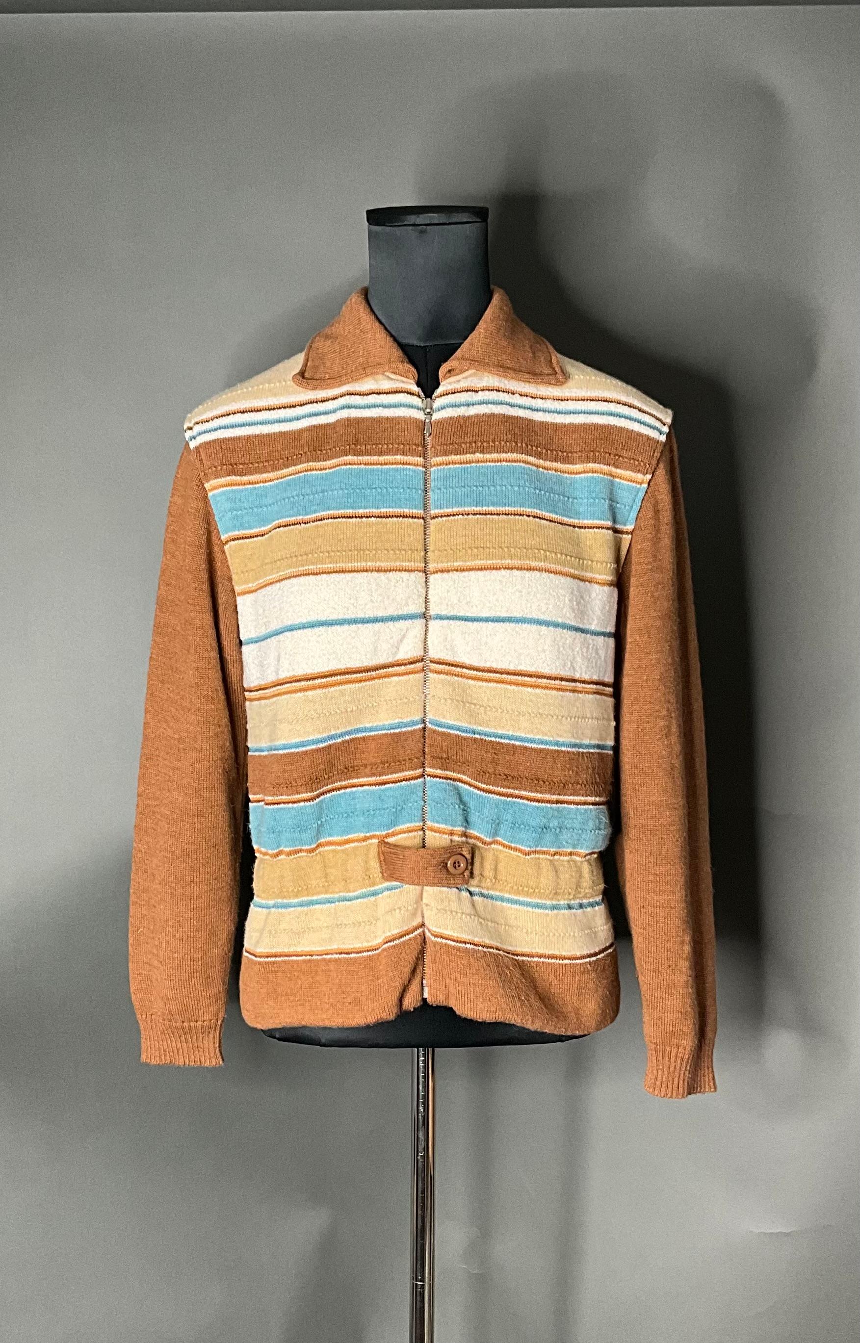 A Vintage Courrèges Paris 70s Sweater is a classic and iconic piece from the renowned French fashion house Courrèges, known for its innovative designs and cutting-edge approach to fashion in the 1960s and 1970s. This sweater embodies the bold,