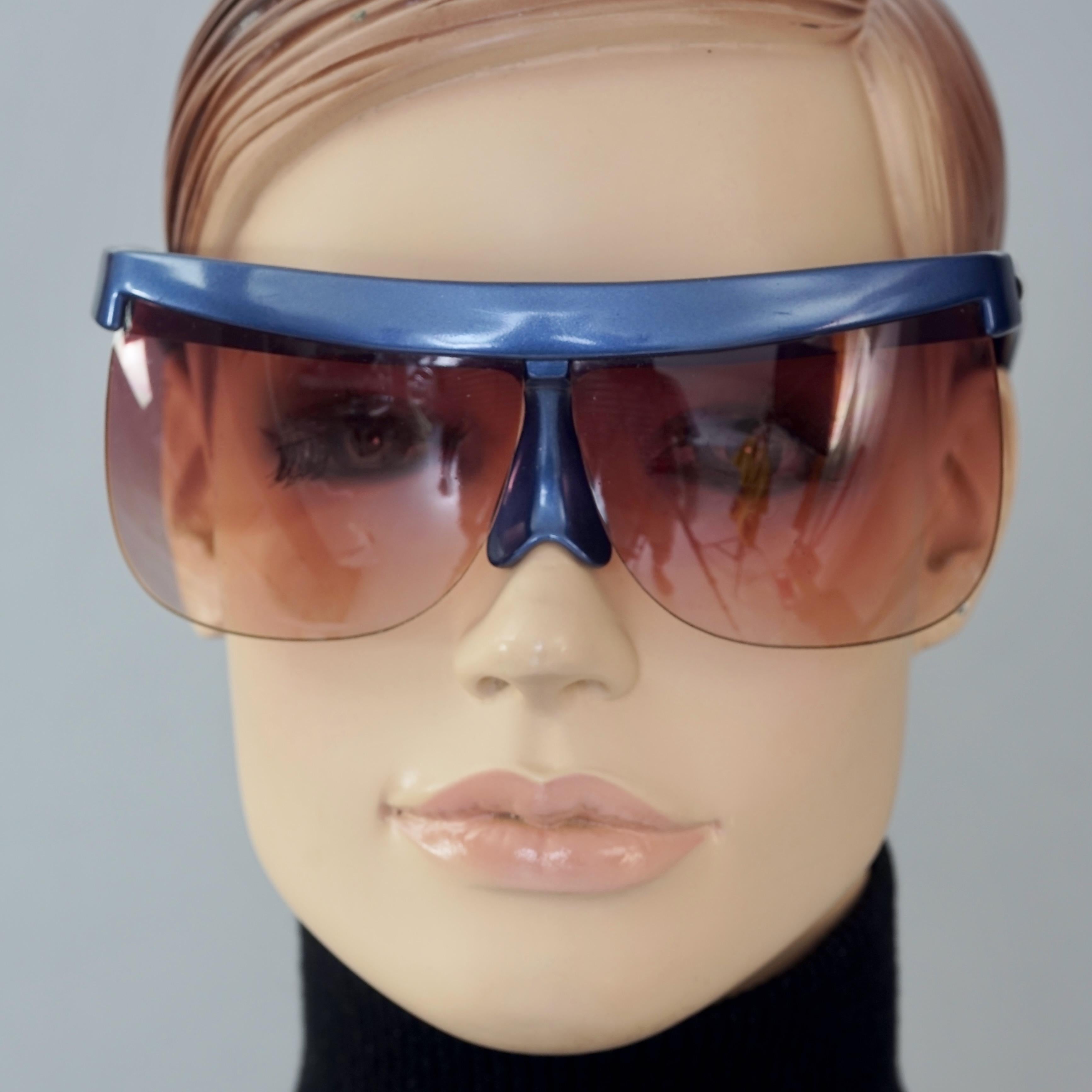 Vintage COURREGES Sculptural Futuristic Oversized Blue Sunglasses

Measurements:
Height: 2.36 inches (6 cm)
Horizontal Width: 6.50 inches (16.5 cm)
Temples: 4.72 inches (12 cm)

Features:
- 100% Authentic ANDRE COURREGES. 
- Oversized futuristic