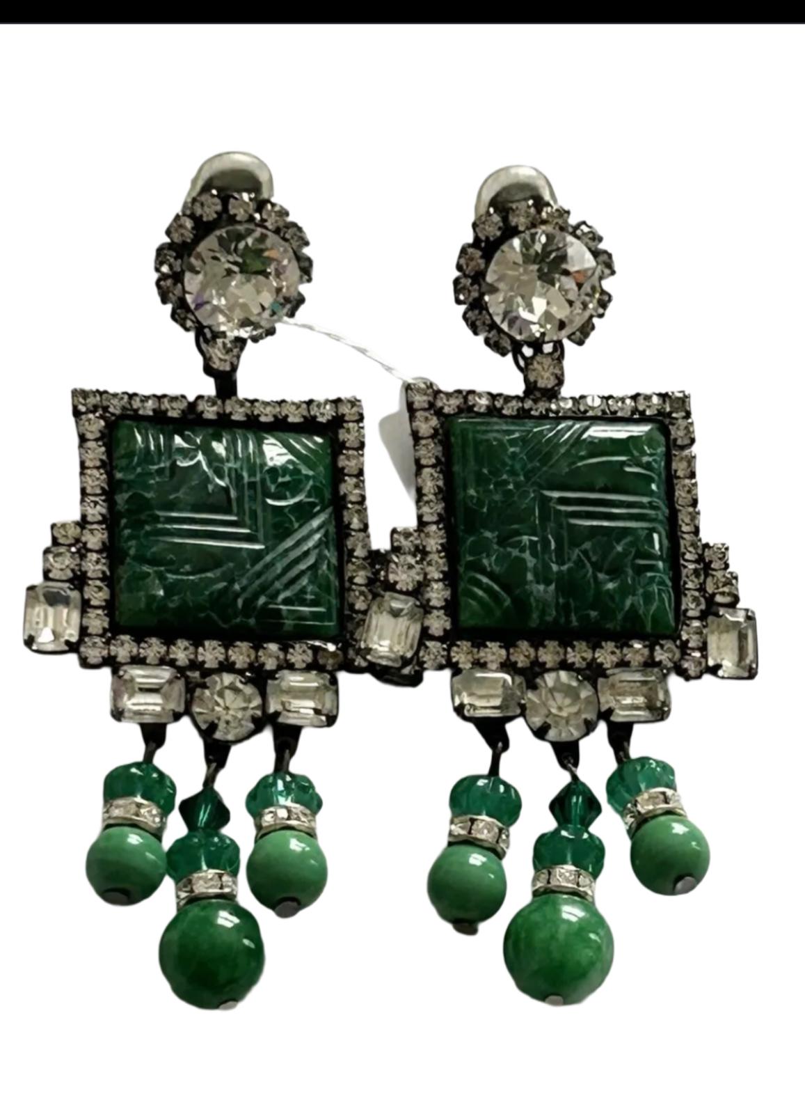 These gorgeous green couture earrings are signed by Moans. These are true runway pieces .

They are beautiful earrings and such a statement!.

These earrings were featured in vogue worn by model on front cover . The ones model is wearing are just a