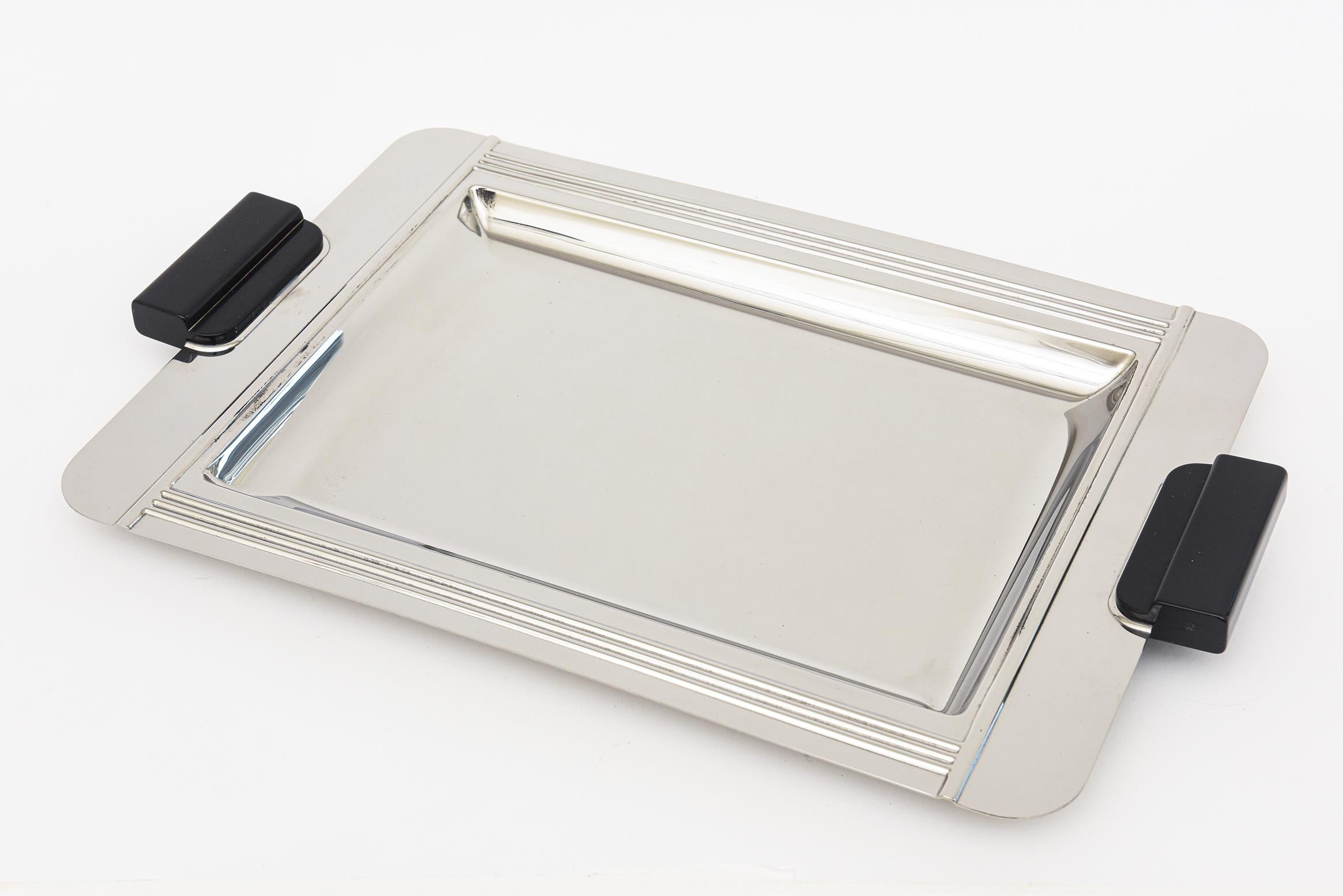 This vintage French stainless steel and black resin tray is marked on the back Couzon Acier Made In France Inox 1870 France. It was made in the 80;s or early 90s. The modernity of this tray is nod to and of the Art Deco style. The incised lines are