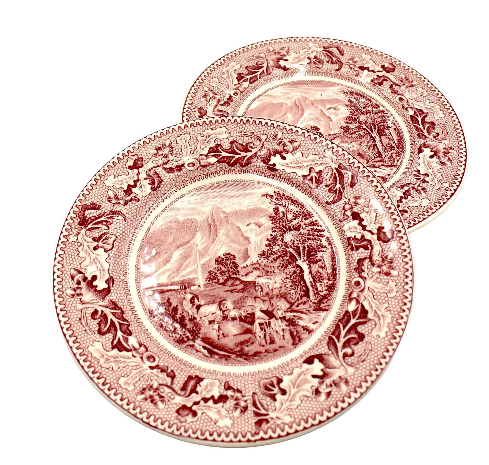 Presented is a set of two red-glazed transferware bread and butter plates, by the famous British potters Johnson Brothers. Made in England, this set comes from their “Historic America” line of ceramics, with the specific pattern celebrating the