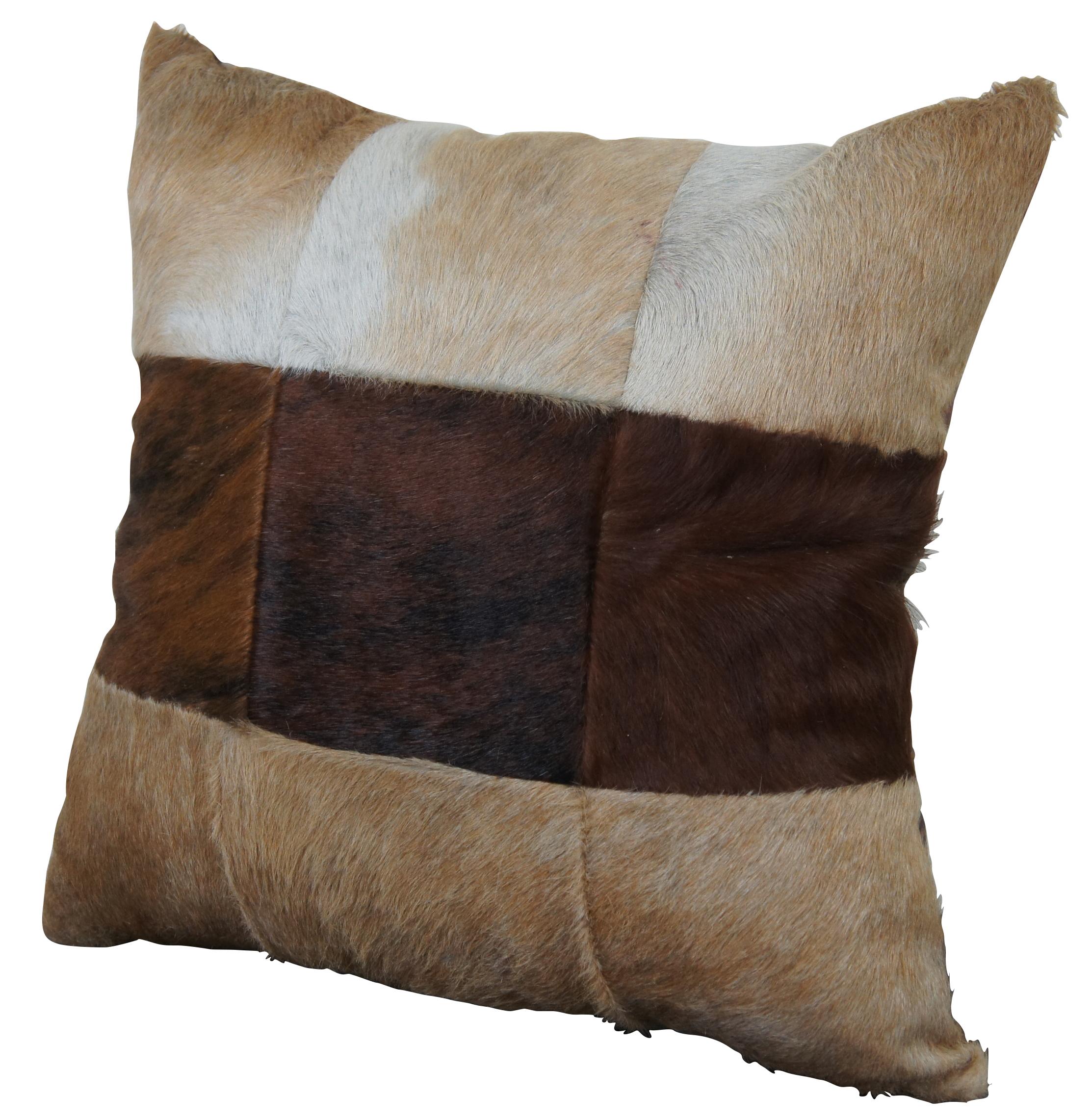 Nine square multi-tone patchwork throw pillow in cow hide fur and leather, filled with small pieces of upholstery foam. Measure: 19
