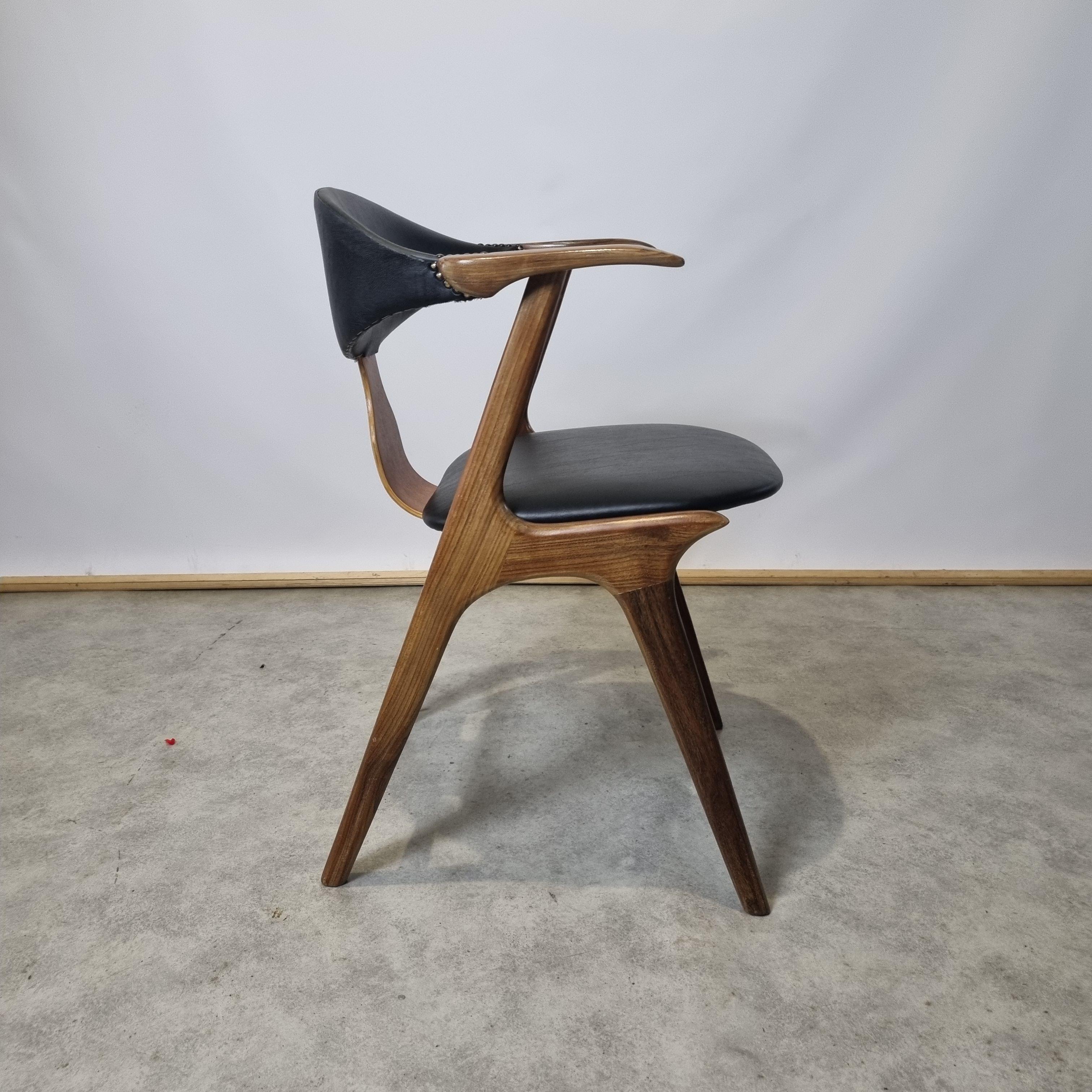 Designed by Louis van Teeffelen for Dutch AWA , made of solid teak. The chair was reupholstered with high quality leatherette which resembles the original upholstery of this chair. It is in perfect condition. The teak frame was refreshed and oiled.