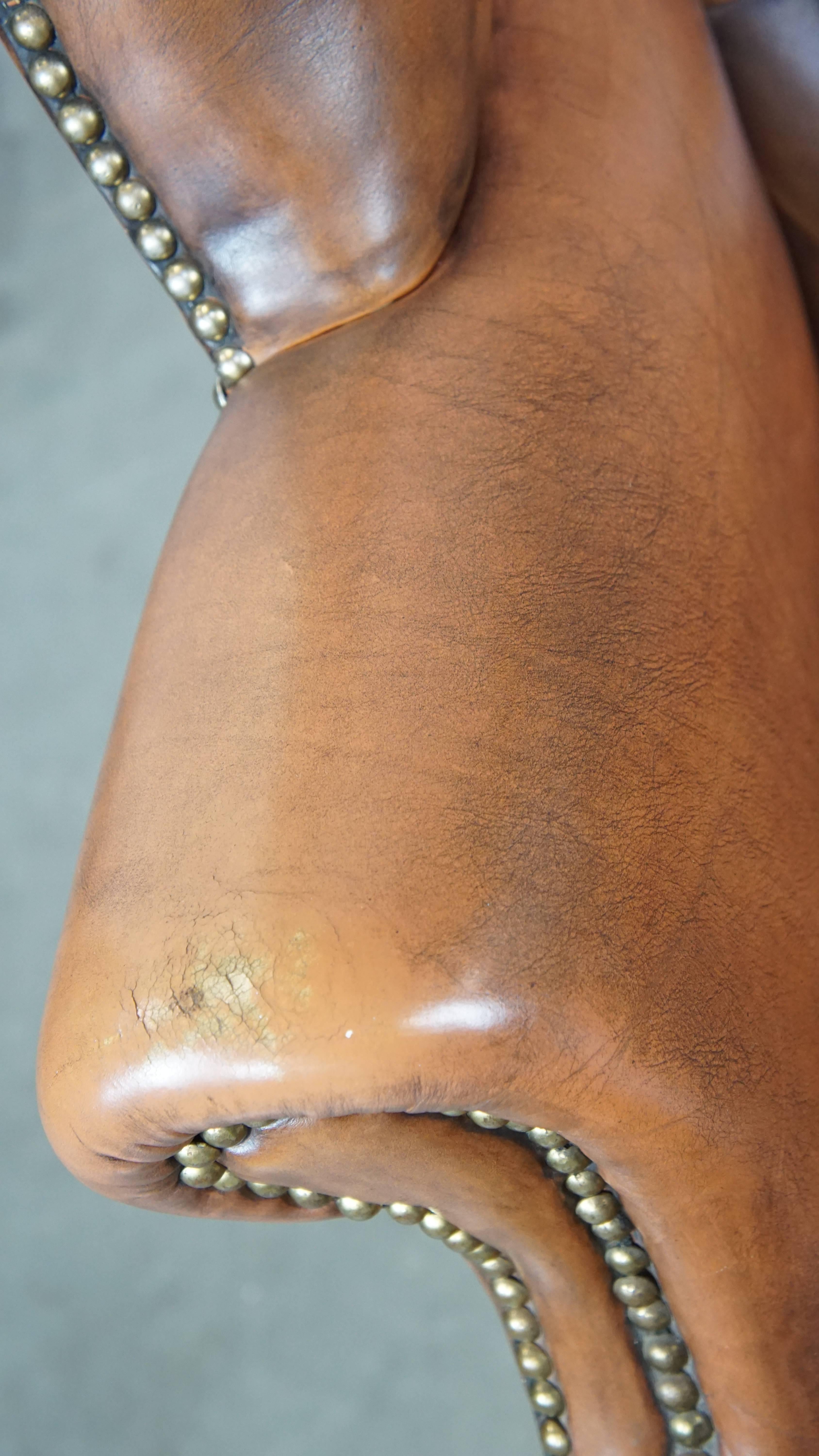 Vintage cowhide leather English Chesterfield wingback chair, light cognac color For Sale 1