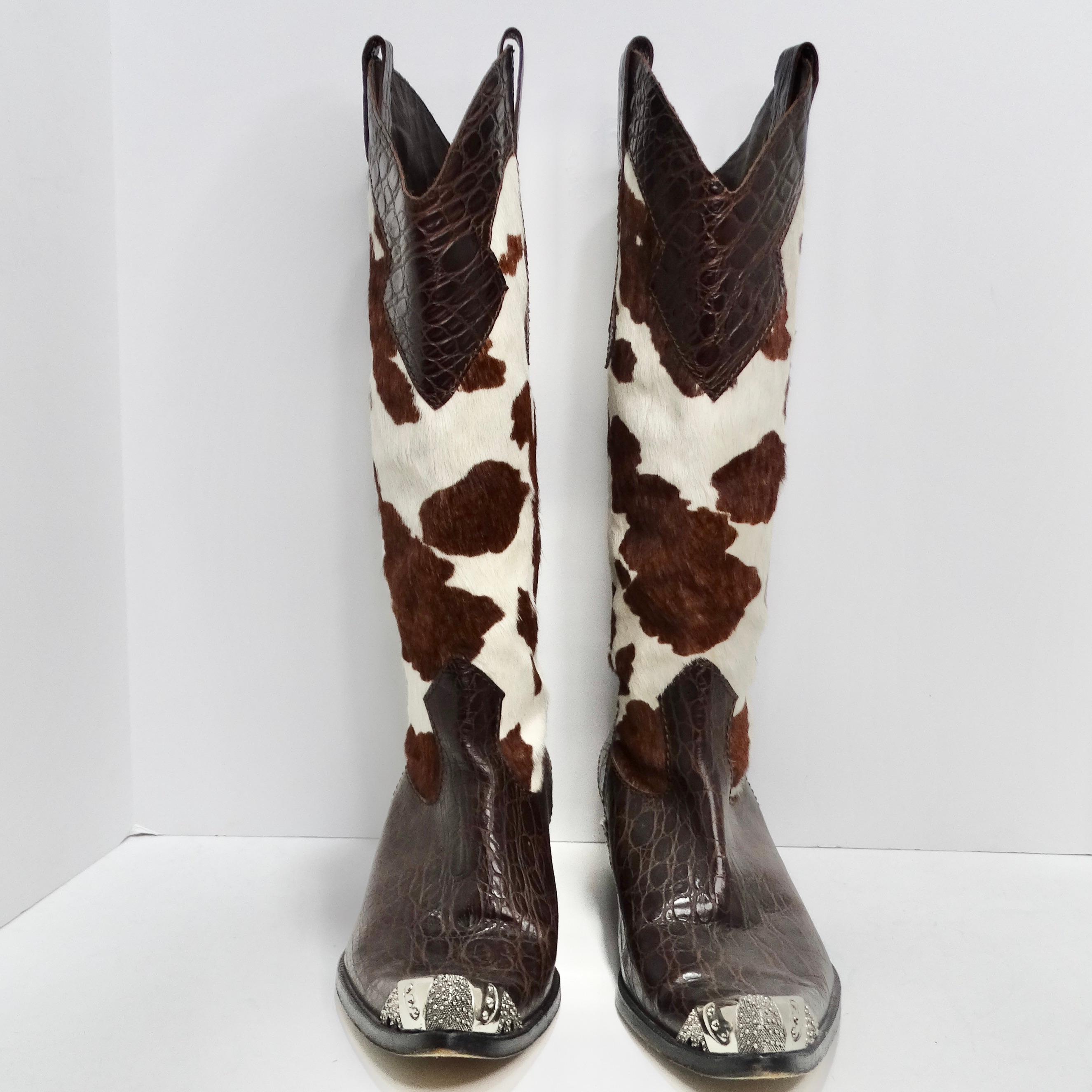 Introducing the Vintage Cowhide Sterling Silver Cowboy Boots—a remarkable pair of statement boots that seamlessly blend Western flair with luxurious details. The boots feature a striking combination of beautiful cowhide fur and rich brown leather.