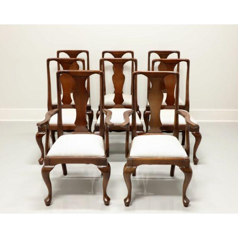 A set of eight Queen Anne style dining chairs by Craftique. Solid mahogany with solid carved backs, cabriole legs, pad feet, light gray and white fabric upholstered seats. Six side chairs and two armchairs. Made in the USA, in the late 20th