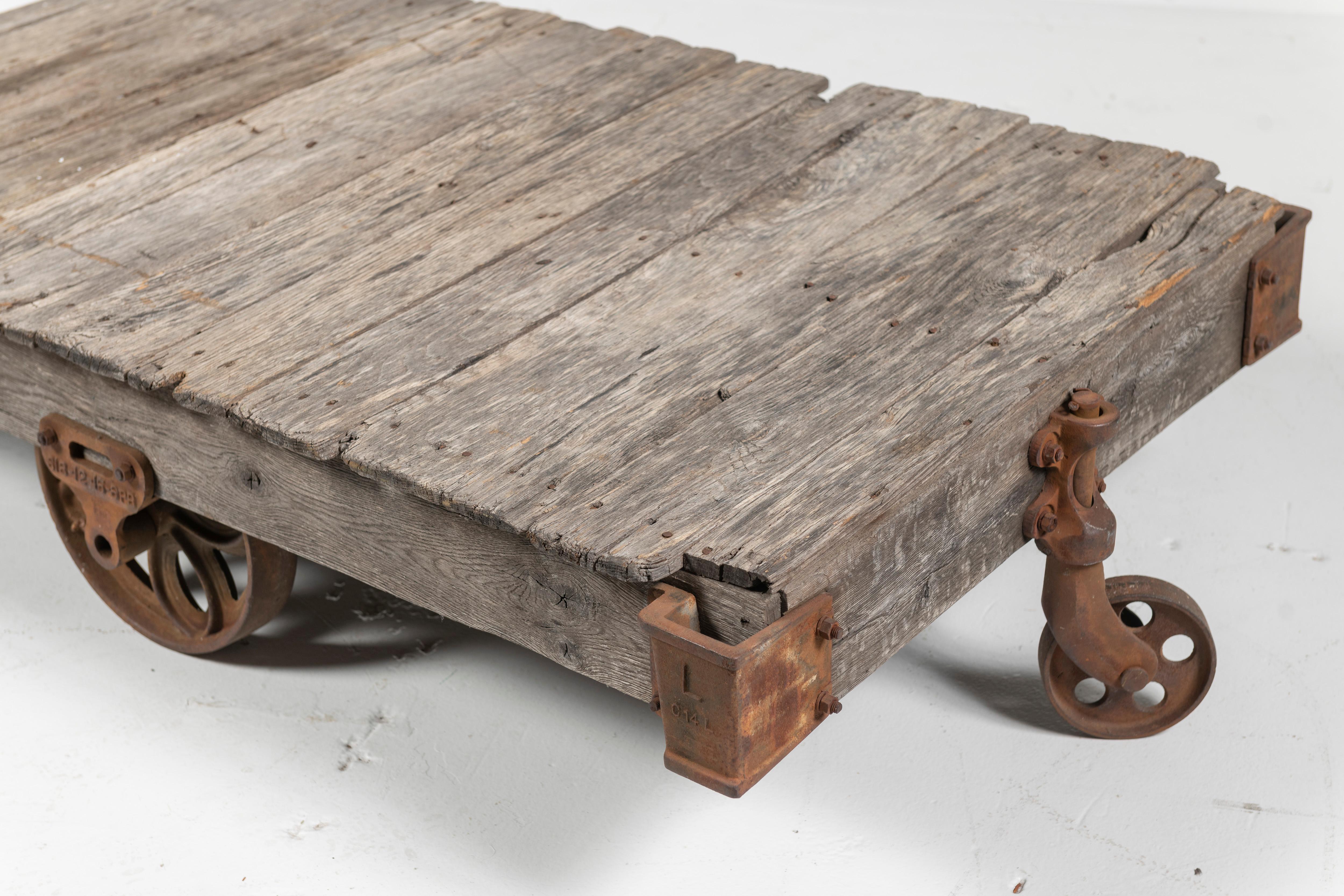 American Vintage Craftsman Cart as Coffee Table, Rustic Wood on Iron Wheels, 20th Century For Sale