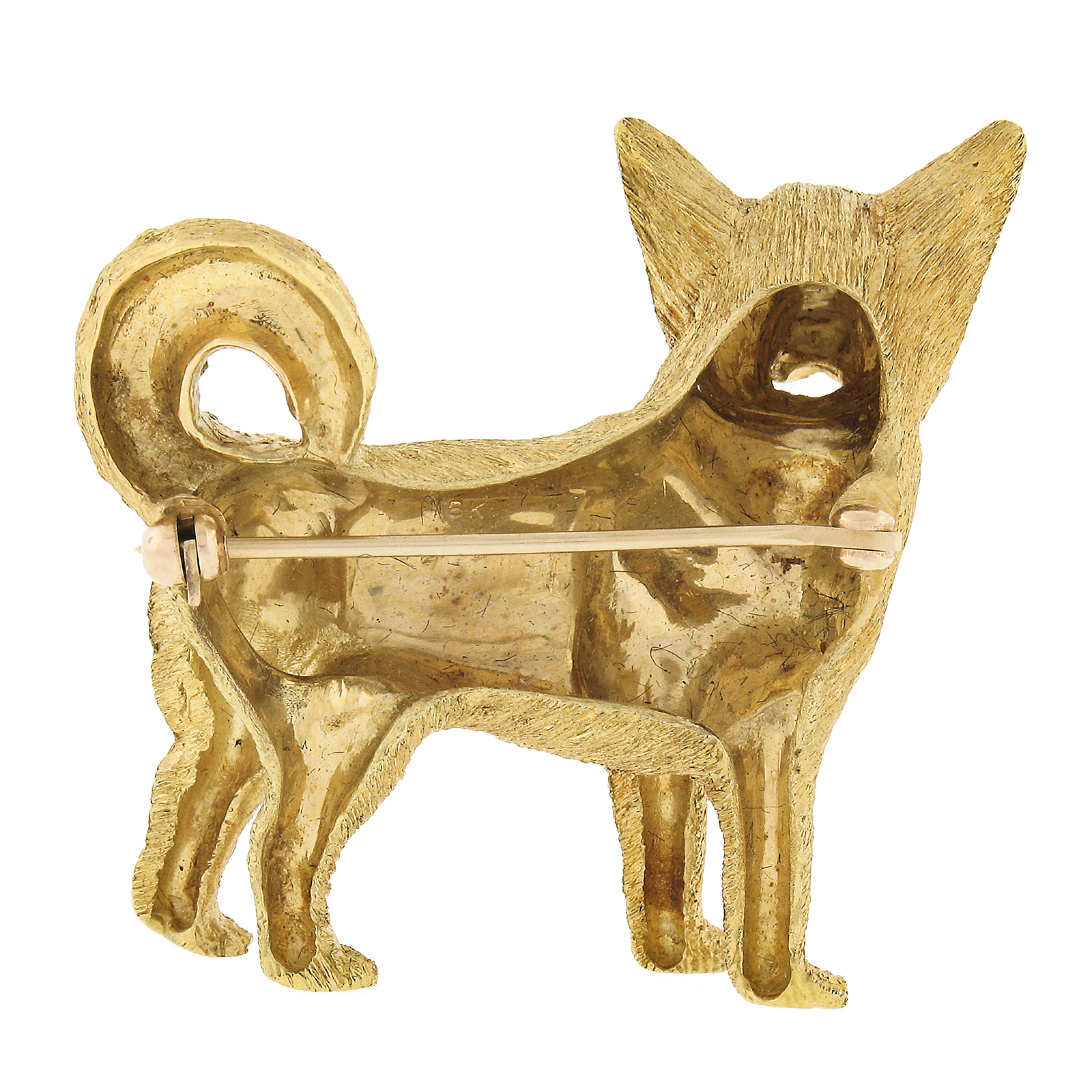 This incredible vintage brooch/pin is designed by Craig Drake and very well crafted in solid 18k yellow gold. It features a perfectly structured standing Shepard dog design with its tongue out showing unique, and remarkably outstanding workmanship