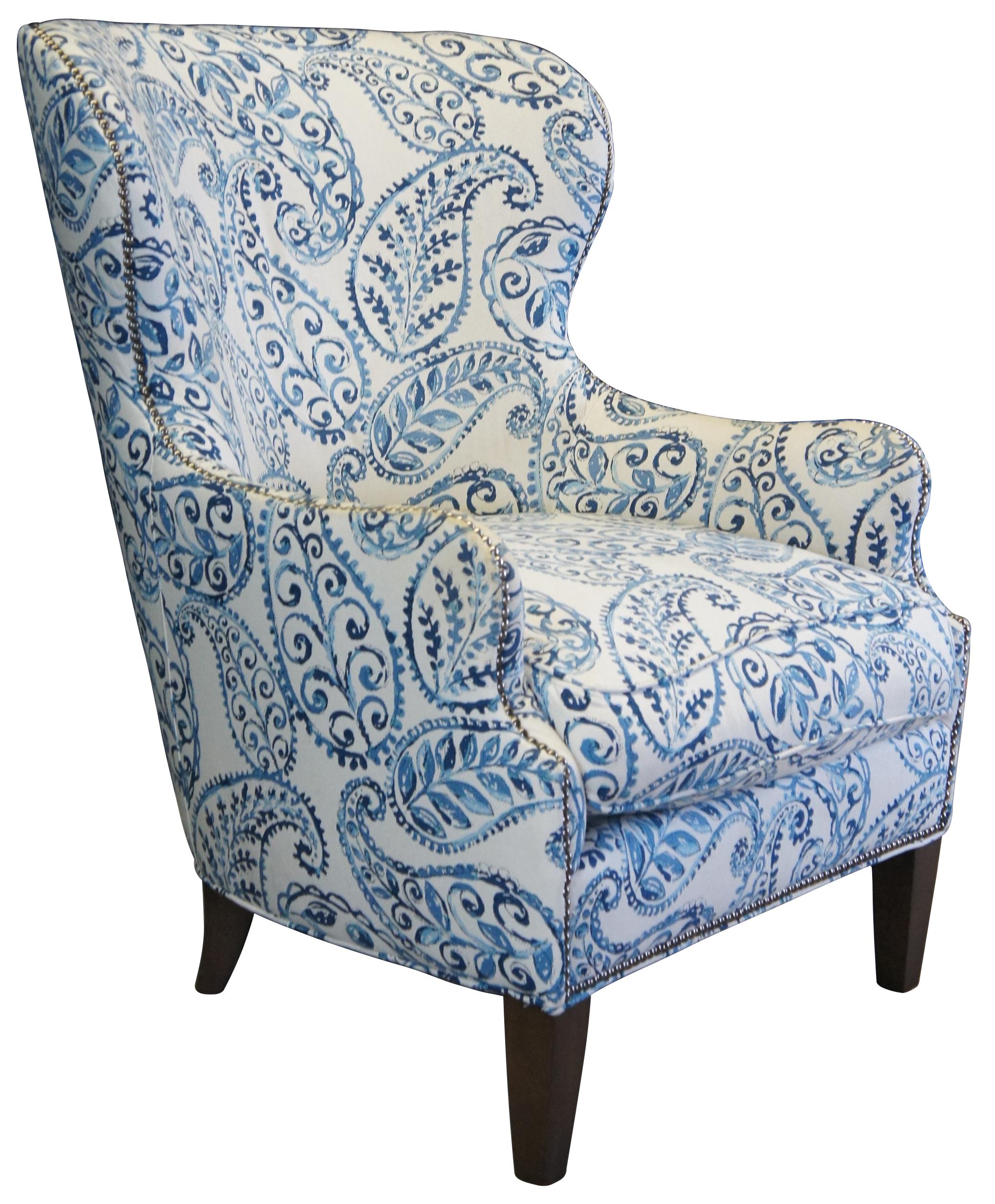 An over scaled paisley print makes the Brielle wing chair an instant statement piece for the living room. Comfortable and conversation-worthy, this updated, classic wingback chair is outlined by hand-applied, platinum-finished nailheads that trace