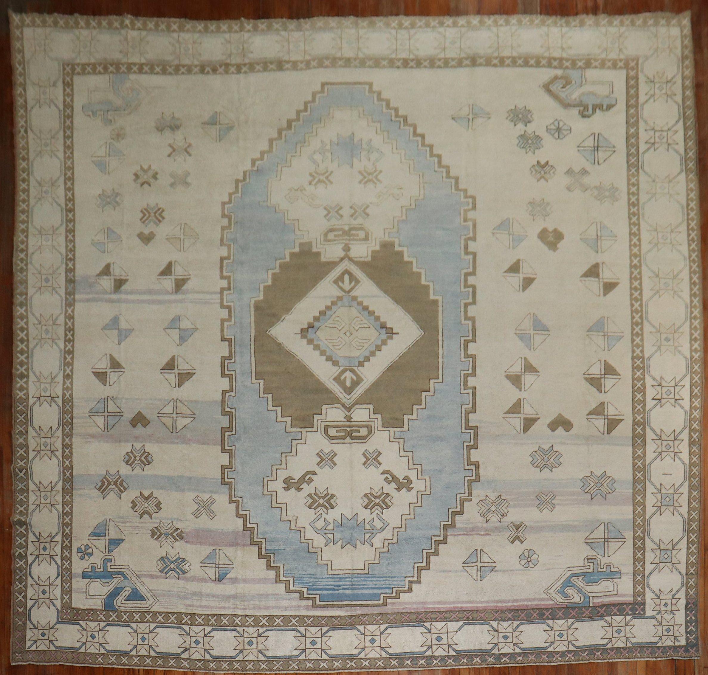 A Mid-20th Century Turkish Rug in predominantly white and blue.

Measures: 13'' x 15'.