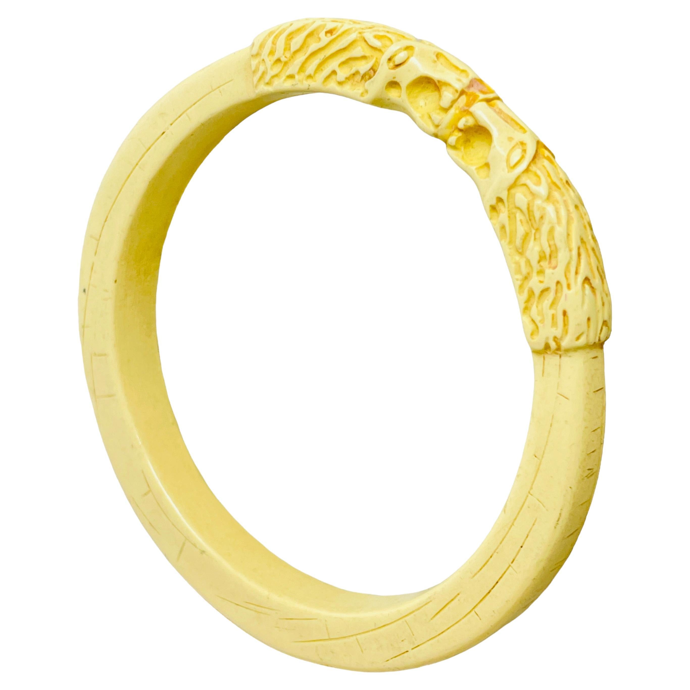 Vintage cream color carved hard plastic lions head bangle bracelet For Sale