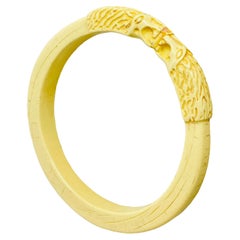 Retro cream color carved hard plastic lions head bangle bracelet