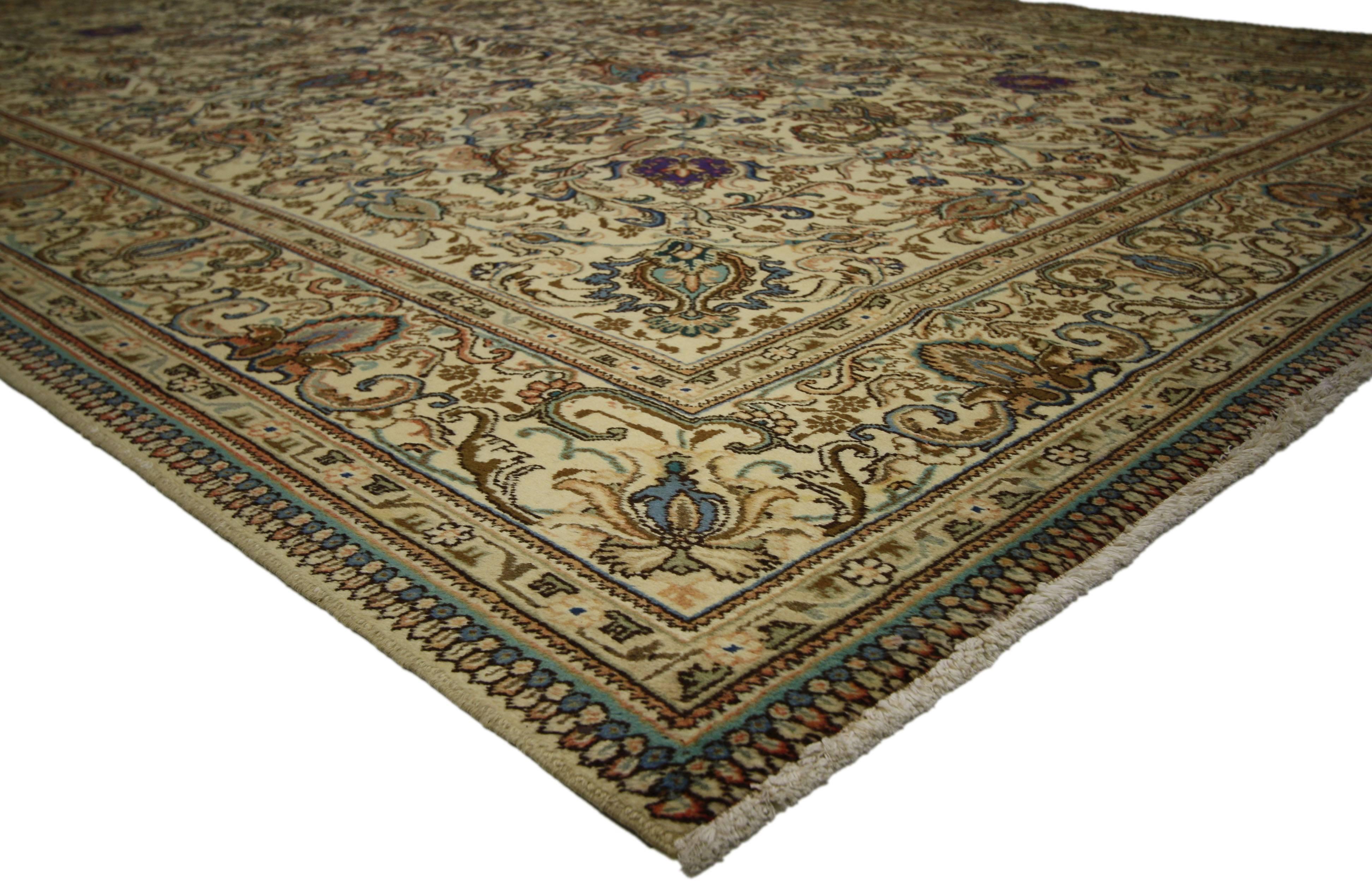 76412 Vintage Persian Tabriz Area Rug 09'06 x 12'10. Timeless and refined, this hand-knotted wool vintage Persian Tabriz rug features an all-over floral patter composed of blooming palmettes, leafy tendrils, rosettes, and swirling arabesque vines