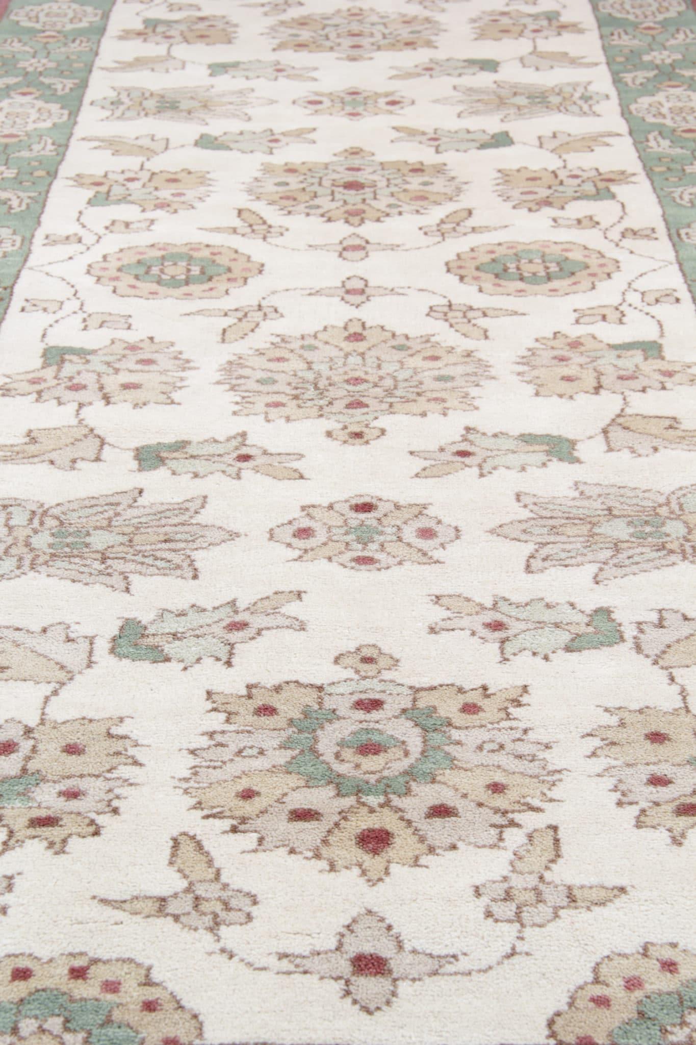 Crafted with precision and care, this hand-knotted masterpiece seamlessly combines traditional charm with modern elegance. Featuring a harmonious blend of cream and green hues, this rug exudes a soothing and inviting aura.
 

 Hailing from Pakistan,