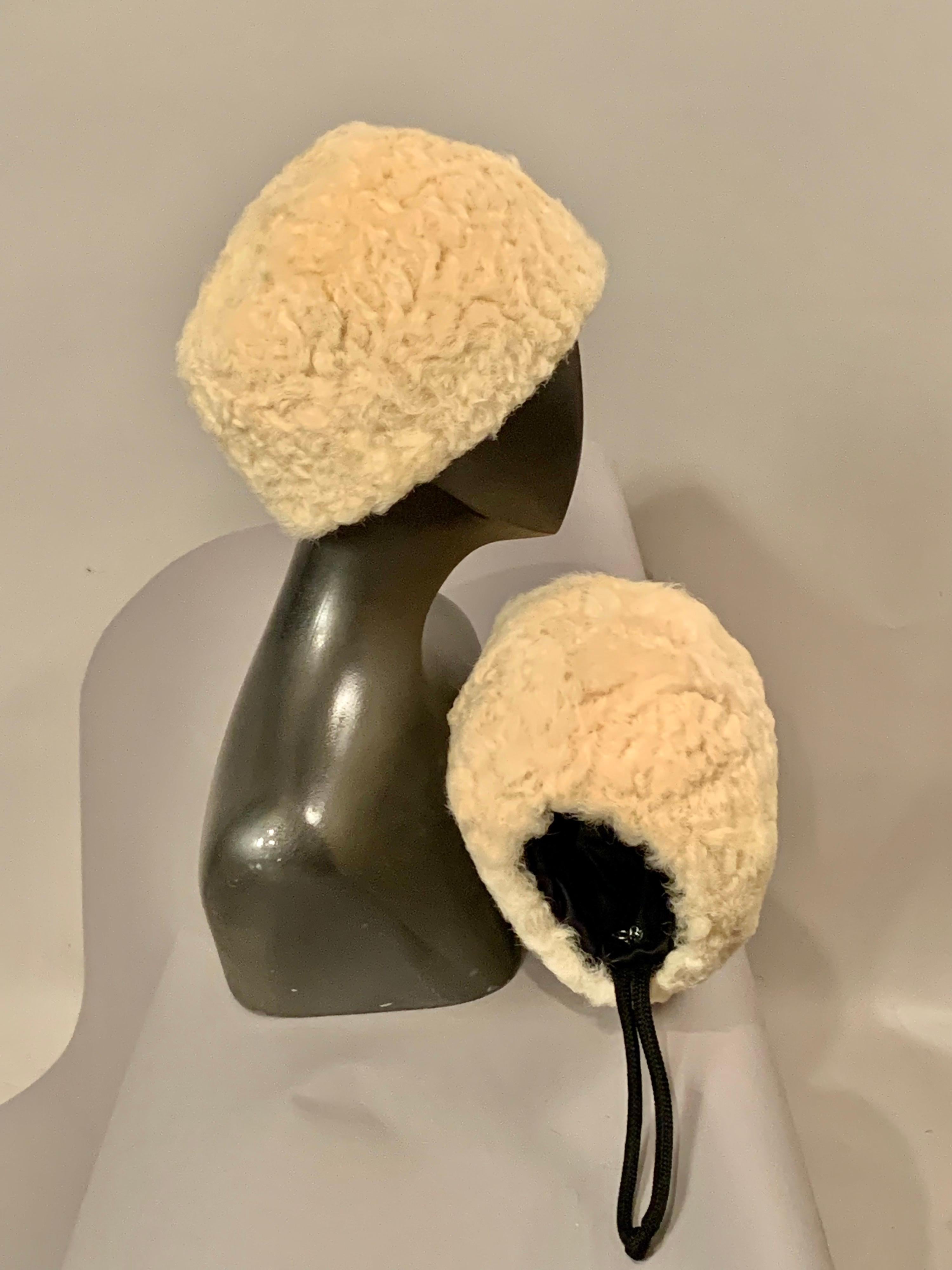 The perfect pair for colder weather is this chic shearling hat and matching muff retailed by Macy's.  The hat is lined with taupe wool for extra warmth and the muff is lined with black satin.  There is an interior zippered pocket and a black cord