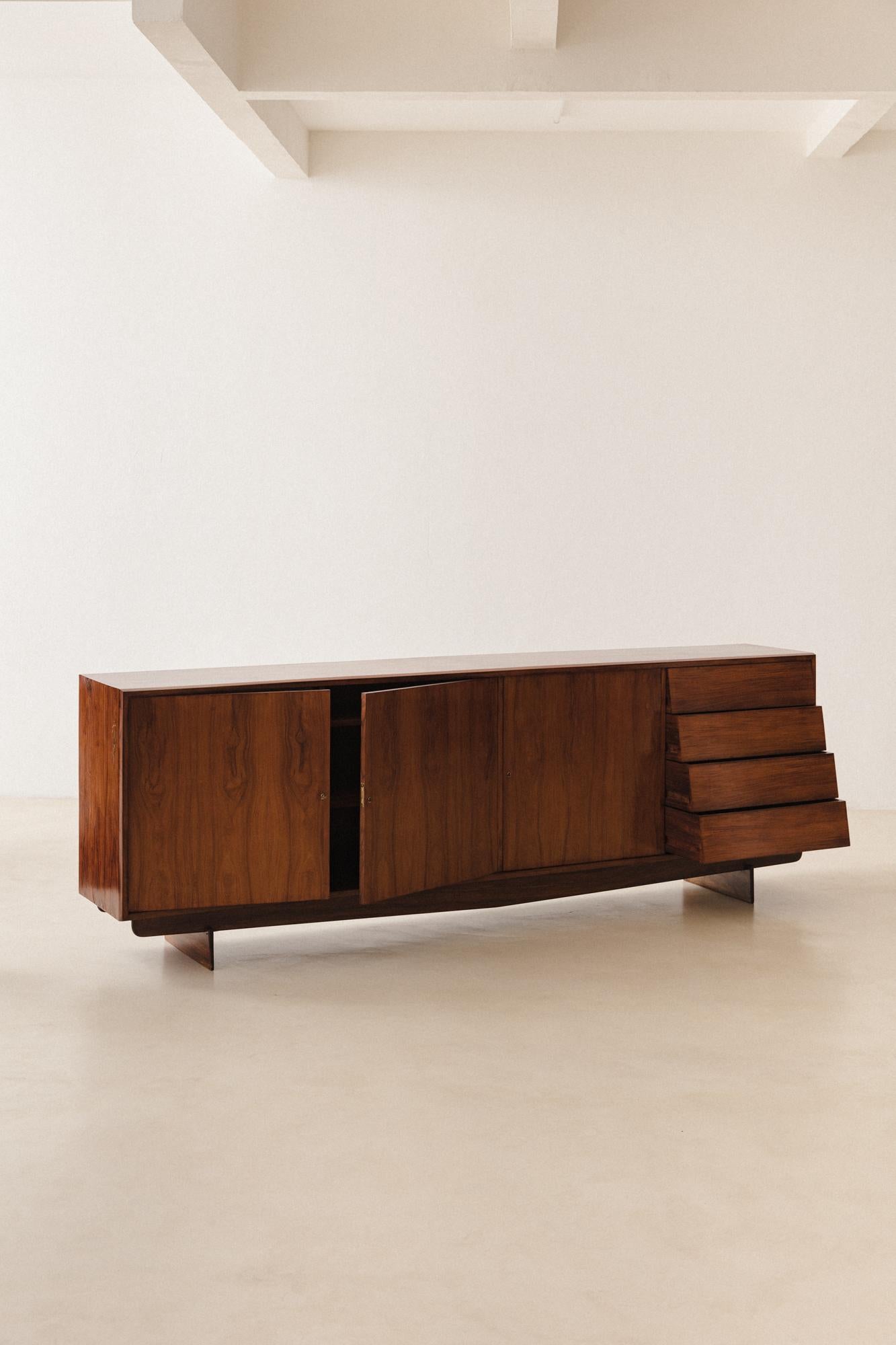 This Caviuna Credenza was designed by Martin Eisler (1913-1977) for Forma S.A. Móveis e Objetos de Arte in the 1950s.

This furniture typology was very common at the period, appearing in several interior projects published in the most known design