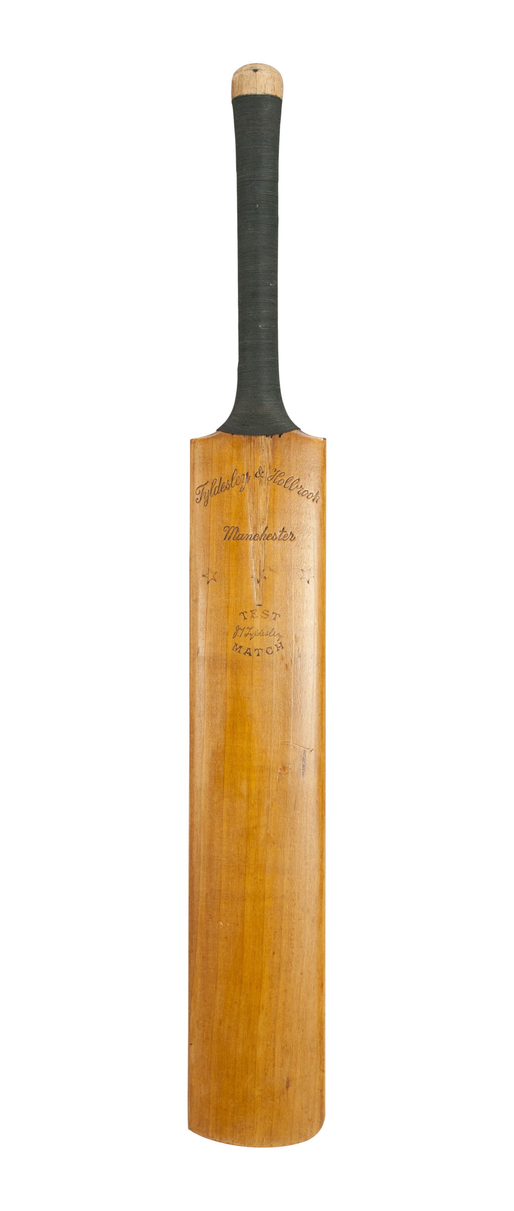 A good Tyldesley & Holbrook cricket bat signed by the 1939 West Indies v England Cricket Teams. The rear of the bat is signed by both teams to the spine in ink with the innings of the match played at Old Trafford. The signatures are clear and