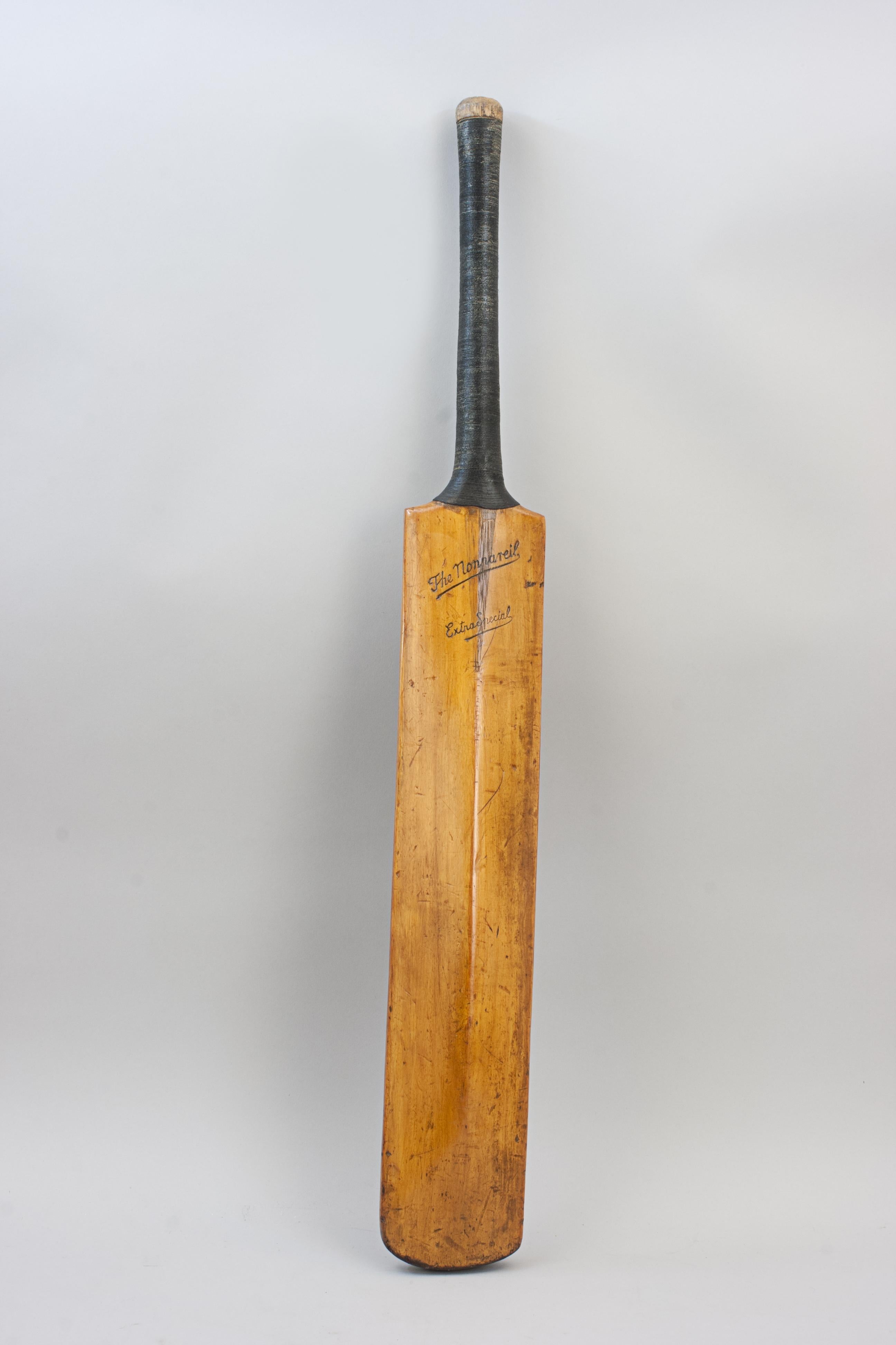 Juniors Willow Cricket Bat.
A good quality willow cricket bat 'The Nonpareil'. The two shoulders stamped 'W.J. Breeden', blade syamped to the front and rear 'The Nonpareil, Extra Special 6'. A nice decorative bat with cord grip. Nonpareil meaning