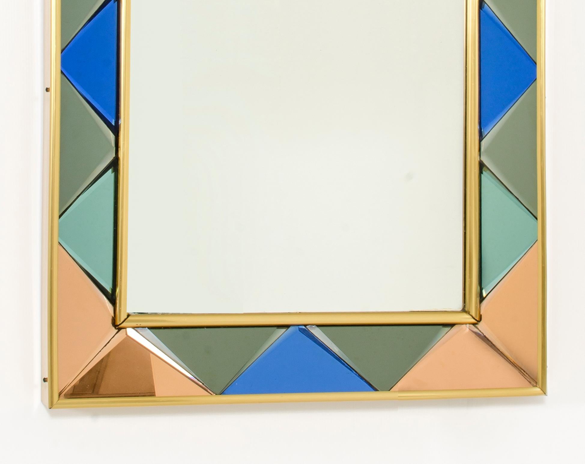 Cristal Art mirror 1960s. Frame with raw plugs made in colored glasses.
Excellent conditions.

   