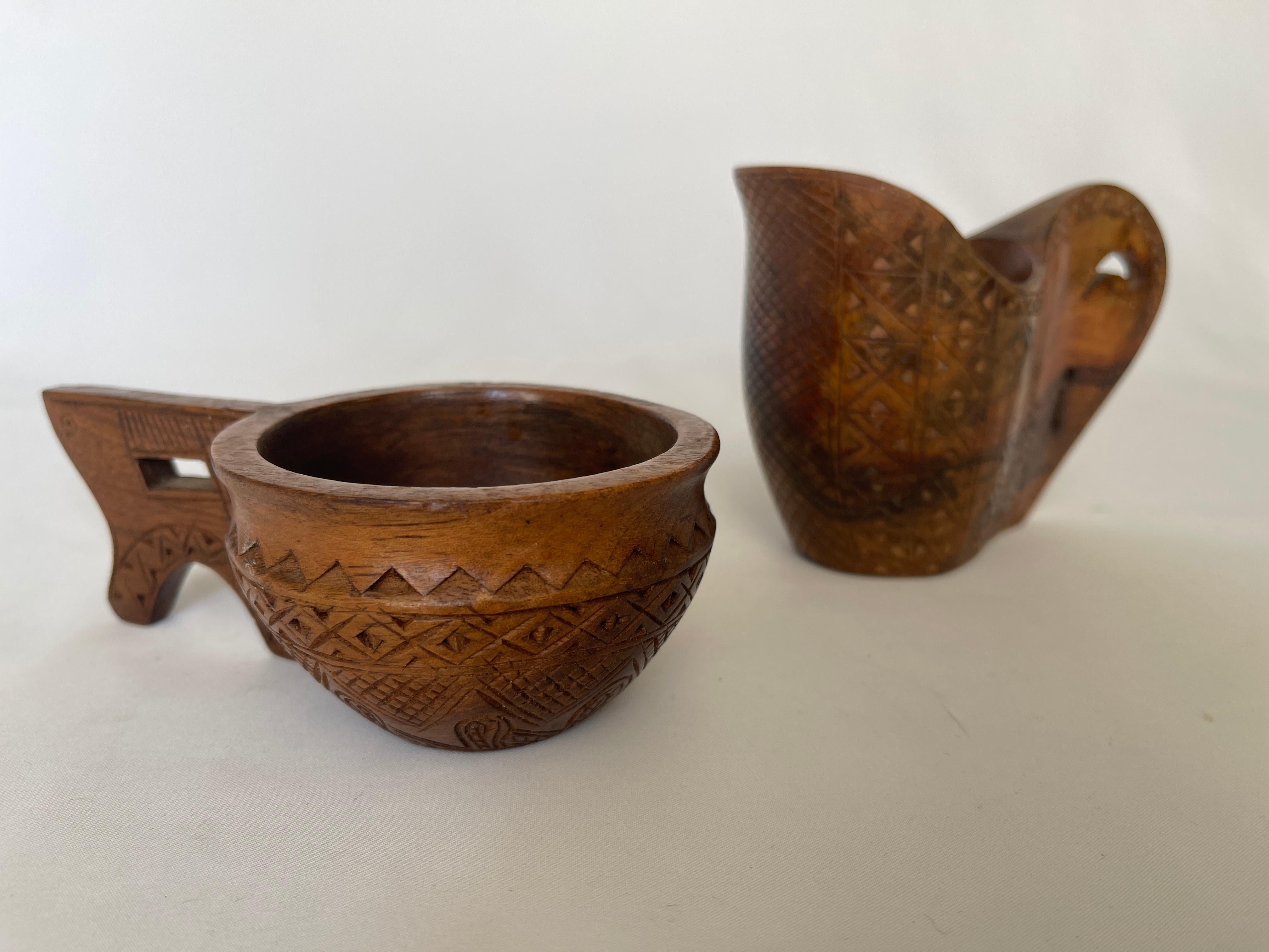 Vintage Croatian shepherd hand carved olive wood sculpture creamer and sugar bowl set. Solid olive wood, with gracefully curved handles and traditional Croatian designs.
Sugar bowl measures 3.2