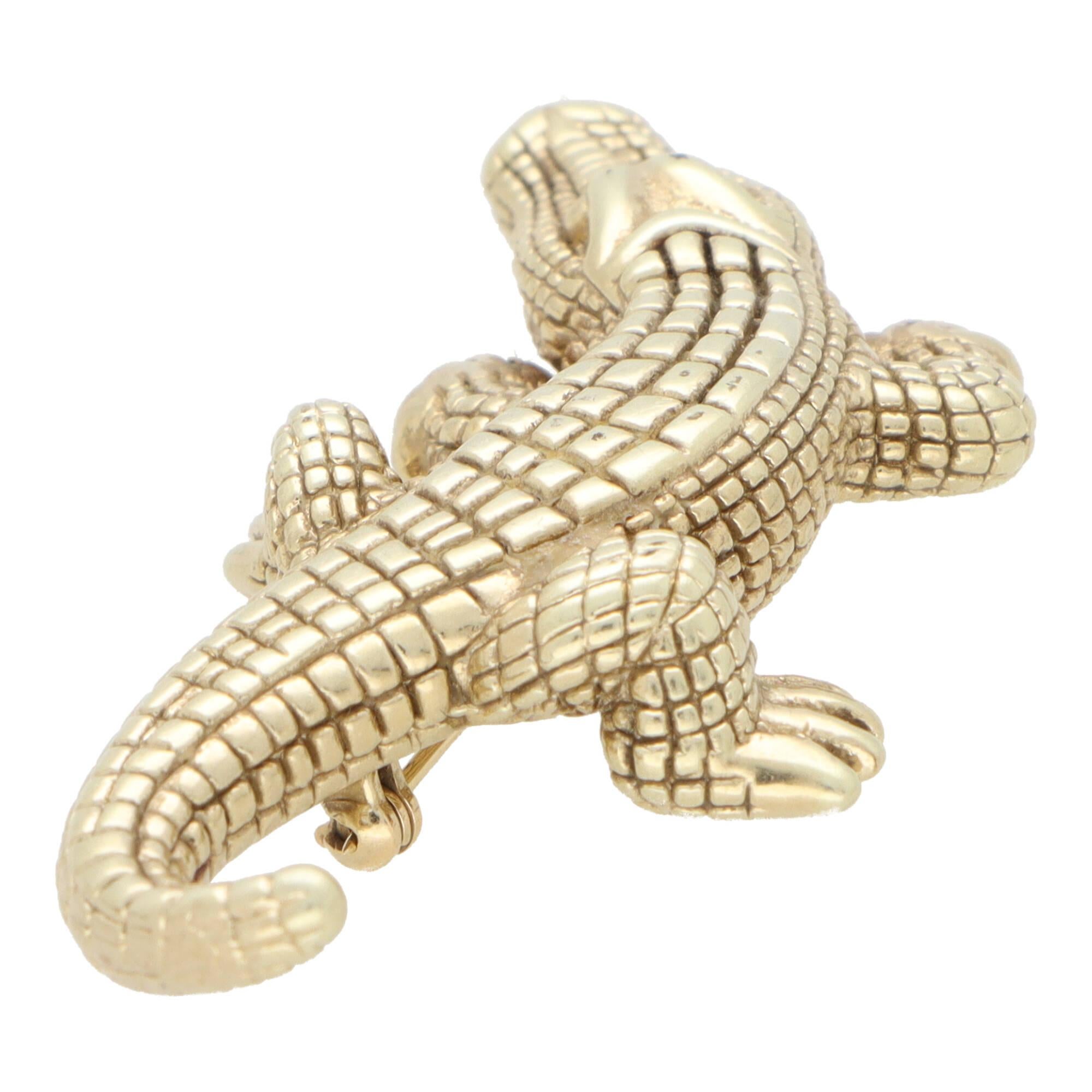A beautiful vintage crocodile brooch set in 14k yellow gold.

The brooch is composed of a heavily detailed crocodile and is design to clamber up/down the wearers coat or jumper. The croc is secured to reverse with a long pin fitting.

Due to the