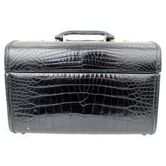 Vieille vanity-case en cuir embossé crocodile