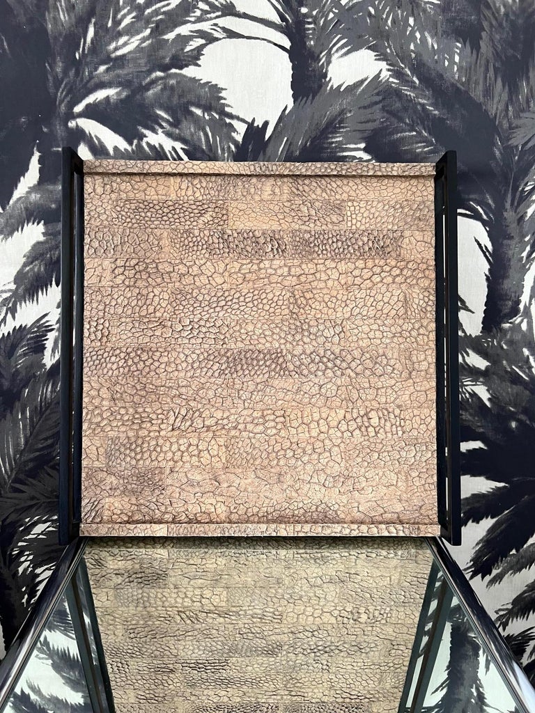 Organic modern tray in genuine crocodile leather with natural hues of tan and brown. The handcrafted tray features sleek handles in ebonized wood. This one-of-a- kind tray is a vintage R&Y Augousti item no longer in production.