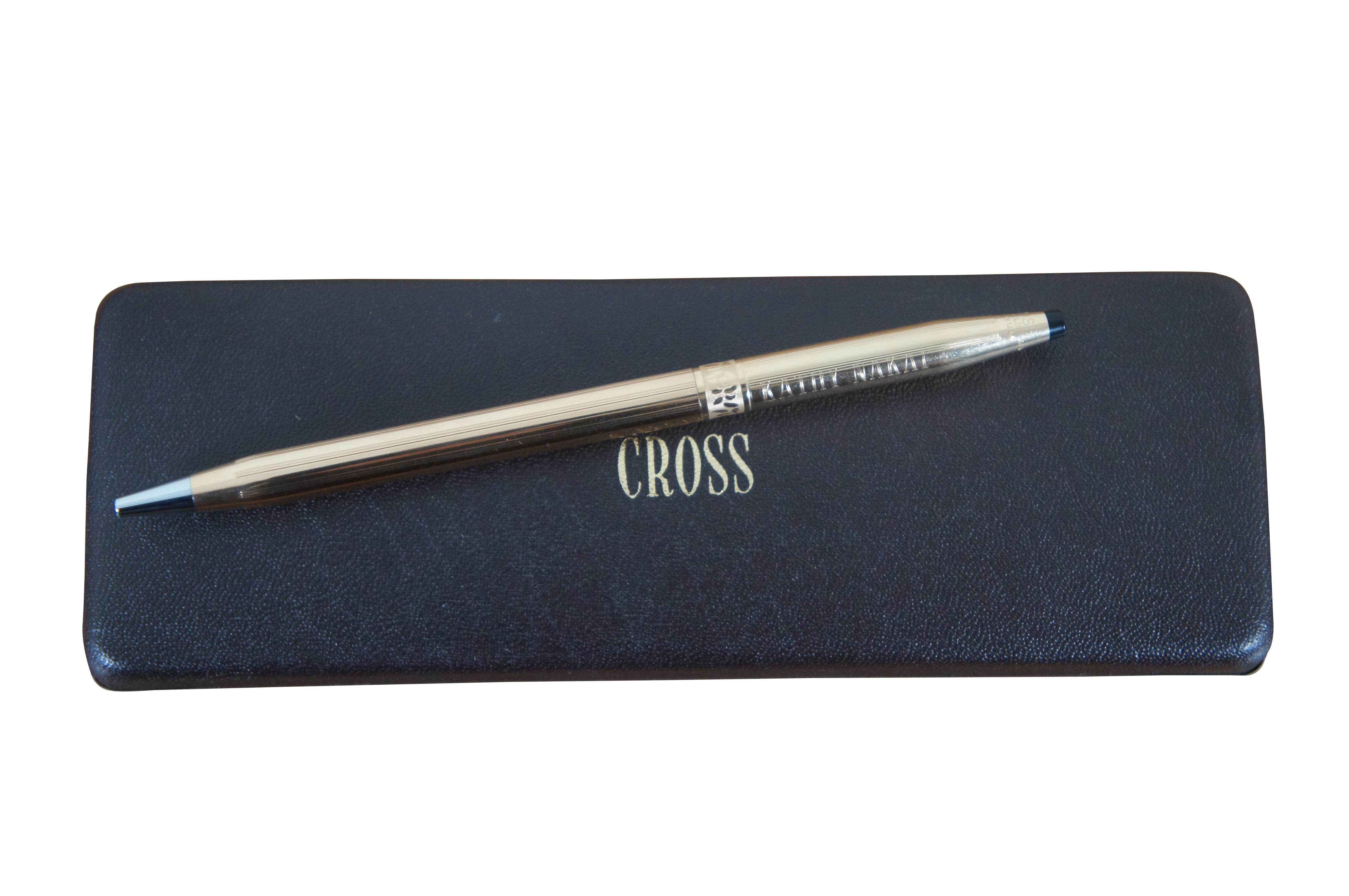 Vintage A.T. Cross refillable 1/20 14K gold filled ballpoint pen featuring a detail band of flowers / roses. Made in USA. Includes original box, dust bag, and leather sleeve. Engraved with the name of original owner.

Dimensions:
0.25