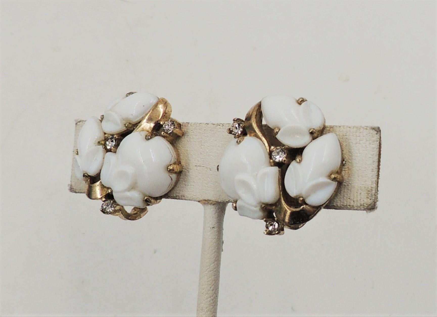 Circa early 1950s white rhinestone acorns with clear round rhinestone accents clip earrings. Marked crown 