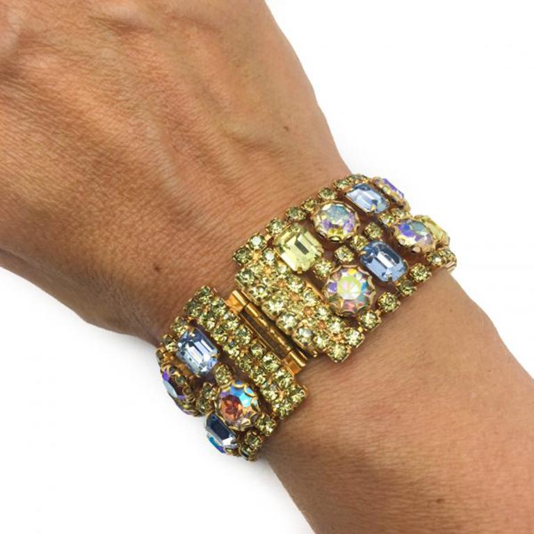 A fabulous 1950s Cocktail Bracelet. Featuring the most incredible acid yellow and pale pink aurora borealis and blue Austrian crystals. The workmanship and attention to detail in this nearly 70 year old piece is exquisite. Measuring 18cm. In very