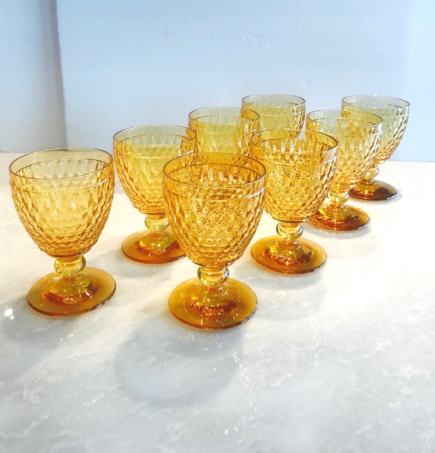 Set of eight luxury crystal goblets from Villeroy & Boch's Boston series. The stemware glasses are comprised of hobnail crystal with classic diamond patterns and deliberate short stems. In gorgeous amber colored crystal, making them a unique and