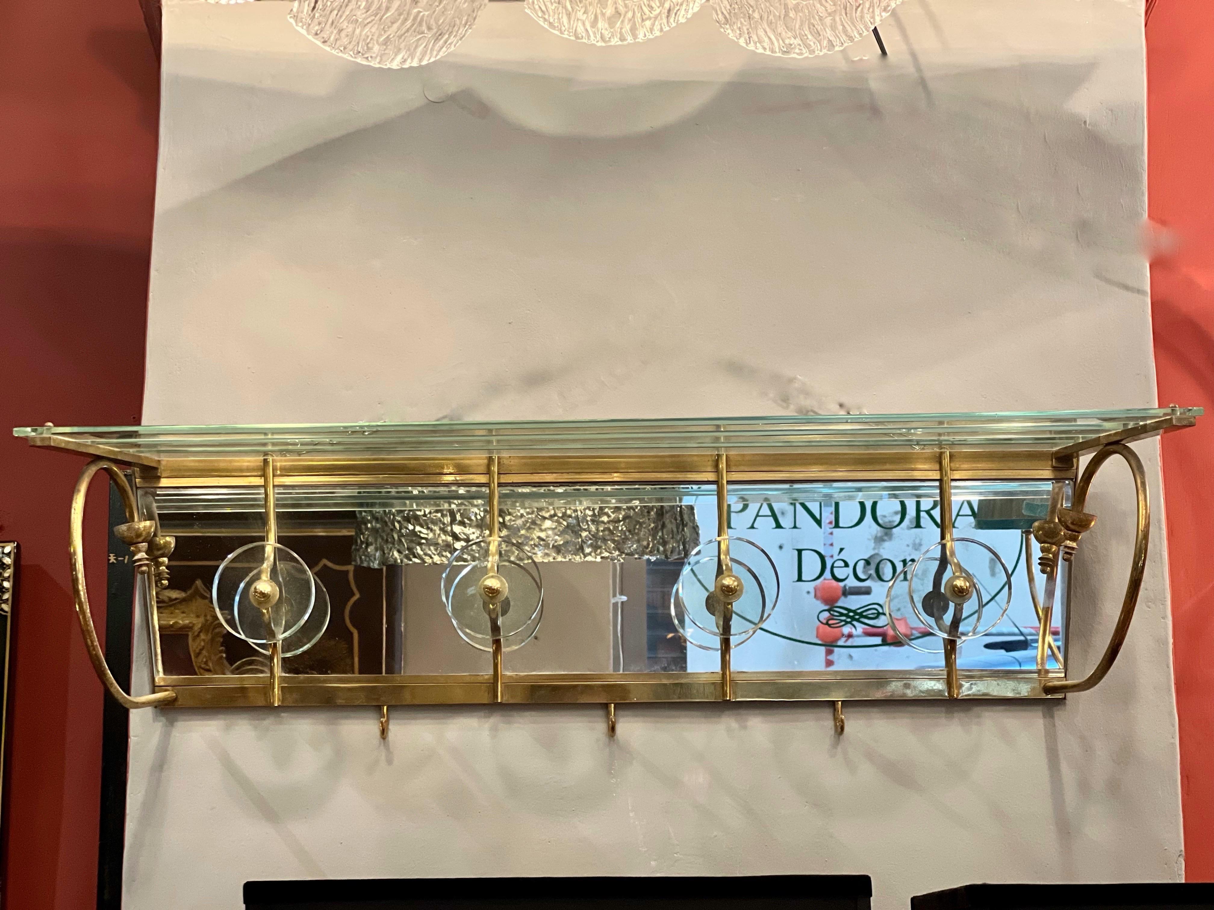 Vintage crystal and brass wall coat racks, midcentury era by Luigi Brusotti, Italy.
4 round crystal hooks and 3 brass hooks.
Very heigh decorative object.
Perfect vintage condition.

