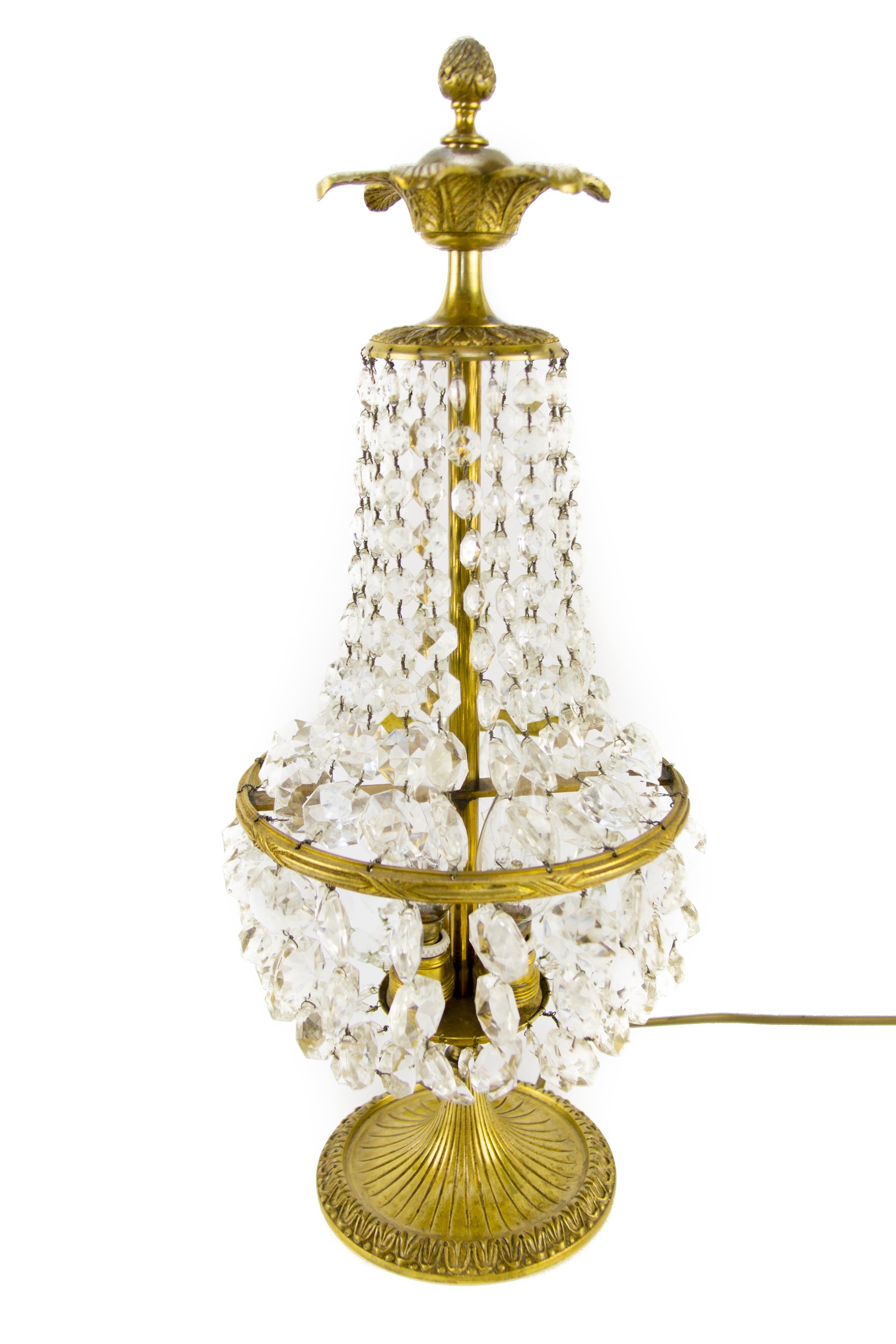 Beautiful Empire style crystal glass and bronze basket table lamp. Three interior lights with E14 size light bulb sockets. France, 1950’s.
Height: 50 cm / 19.6 in; width: 20 cm / 7.8 in.