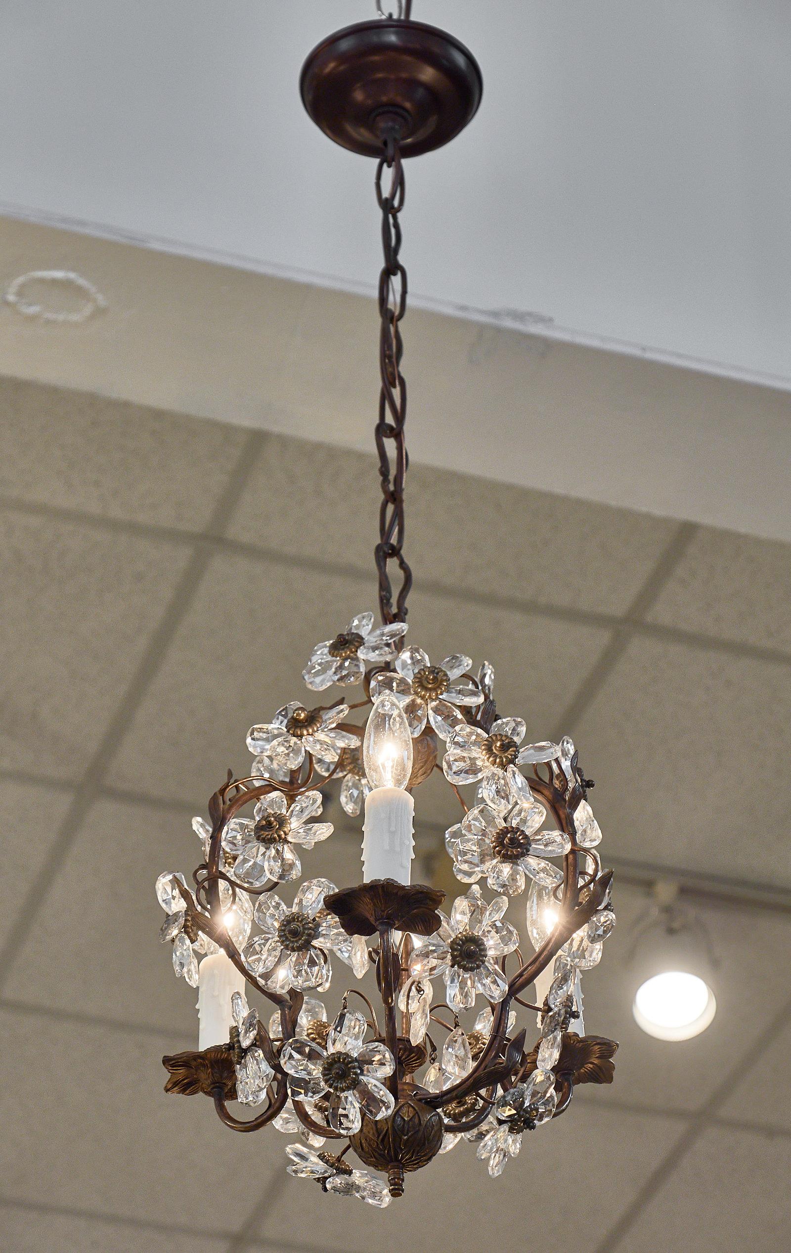 French Art Deco period chandelier with hand cut crystal flowers and gold leafed and hand-hammered structure by Maison Baguès.