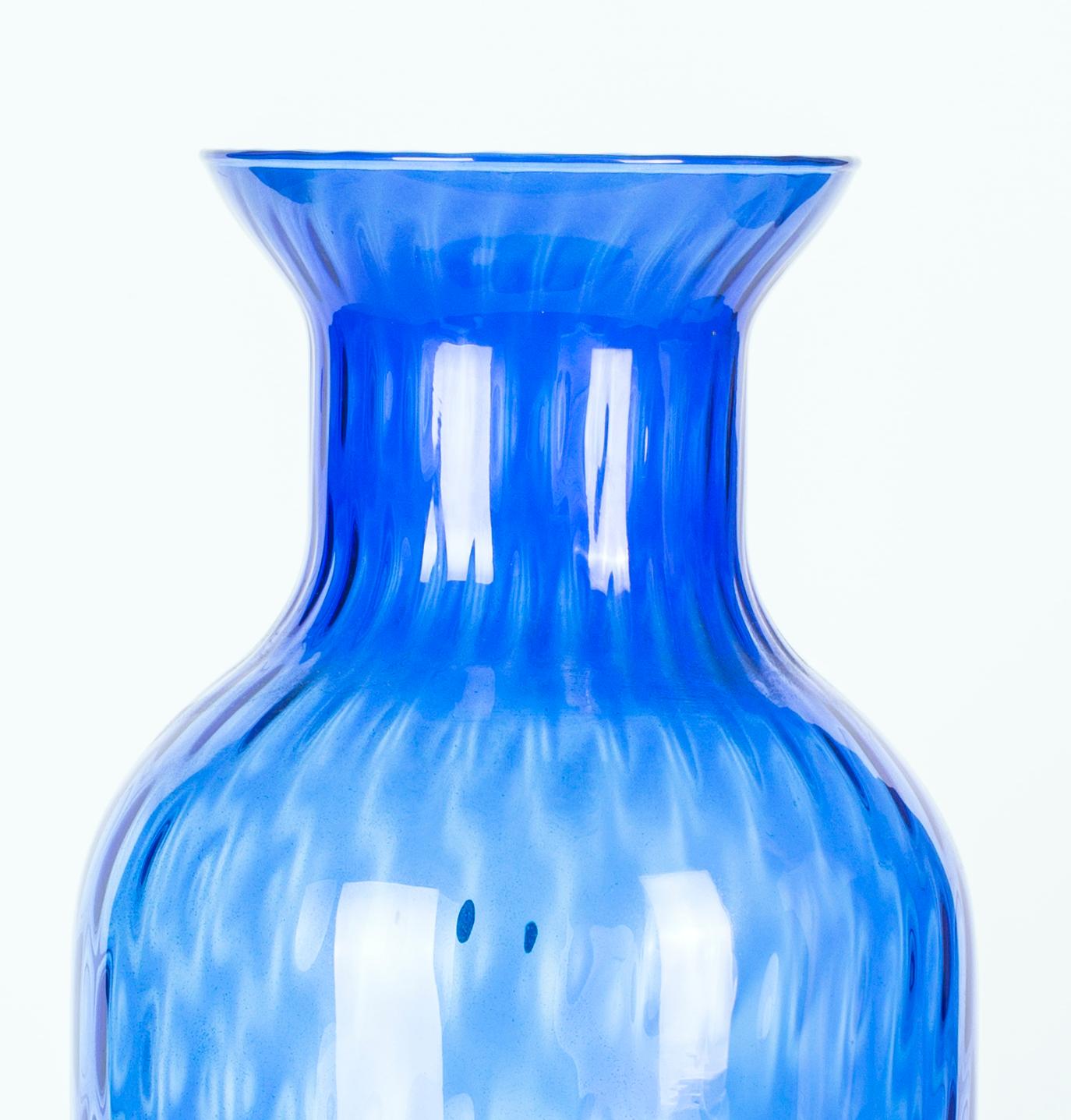 Crystal blue vase is a gorgeous glass decorative object, realized during the 1970s.

A very elegant bright blue colored vase.

On side label of Piombo Crystal.

This large vase is perfect for display as is, or with flowers or other decorative
